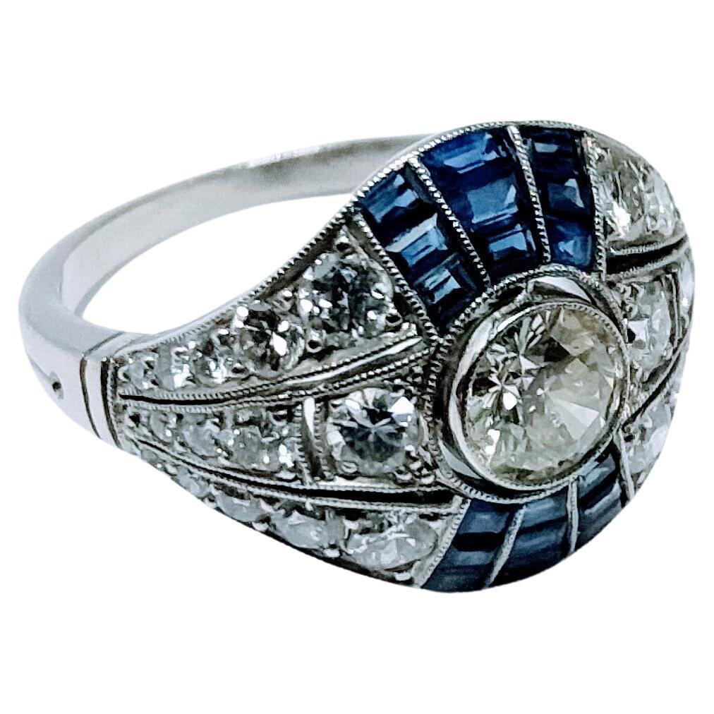 Vintage Art Deco 1930s Ring Brilliant Cut Diamond 0.65 Cts and Sapphire Platinum For Sale