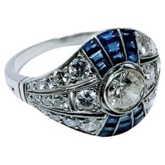 Vintage Art Deco 1930s Ring Brilliant Cut Diamond 0.65 Cts and Sapphire Platinum