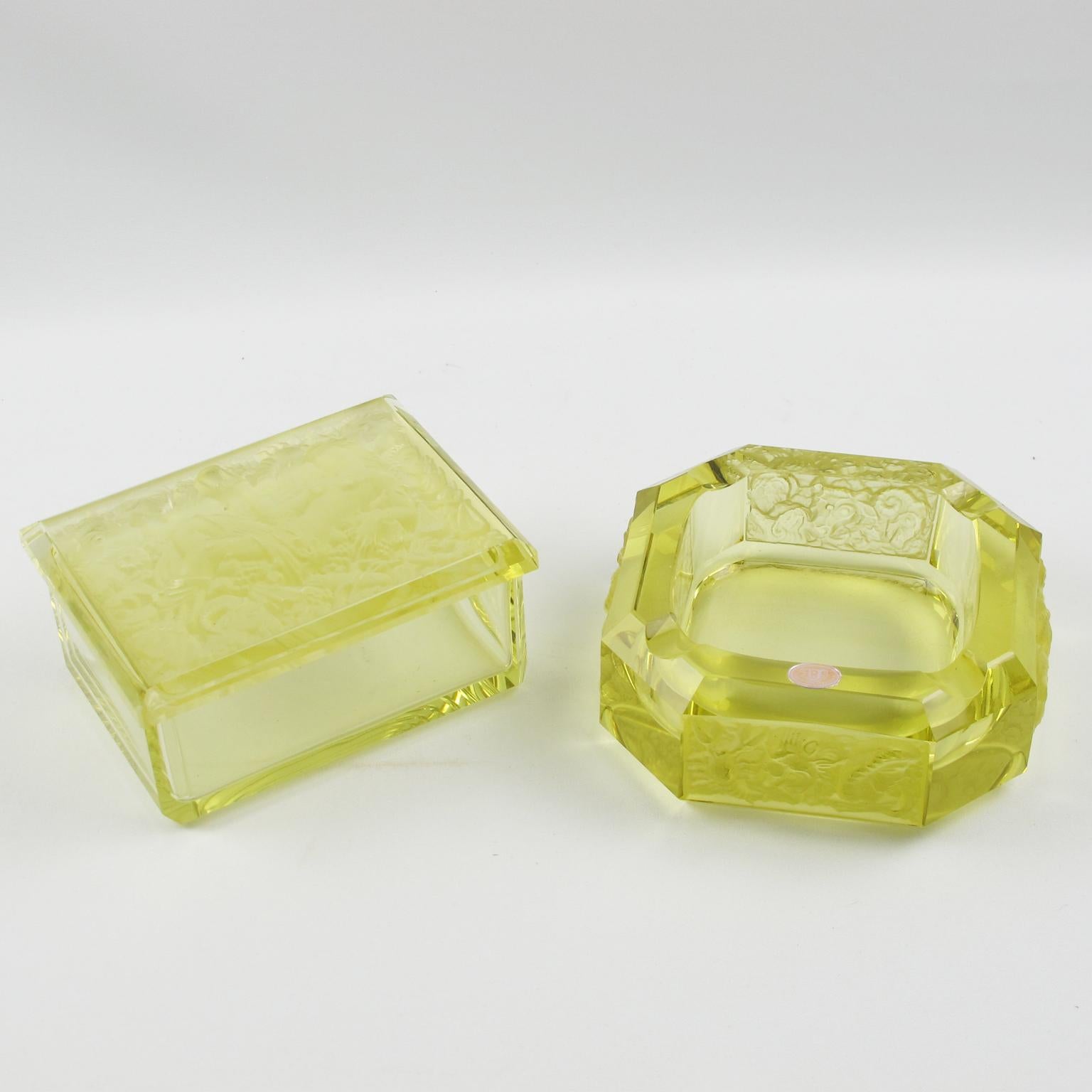 Lovely Bohemian Art Deco glass set for living space or office. Czech set featuring ashtray and decorative lidded box in cut and molded thick and heavy glass. Yellow ouraline Vaseline color. The box has a molded design on top of the lid with nude