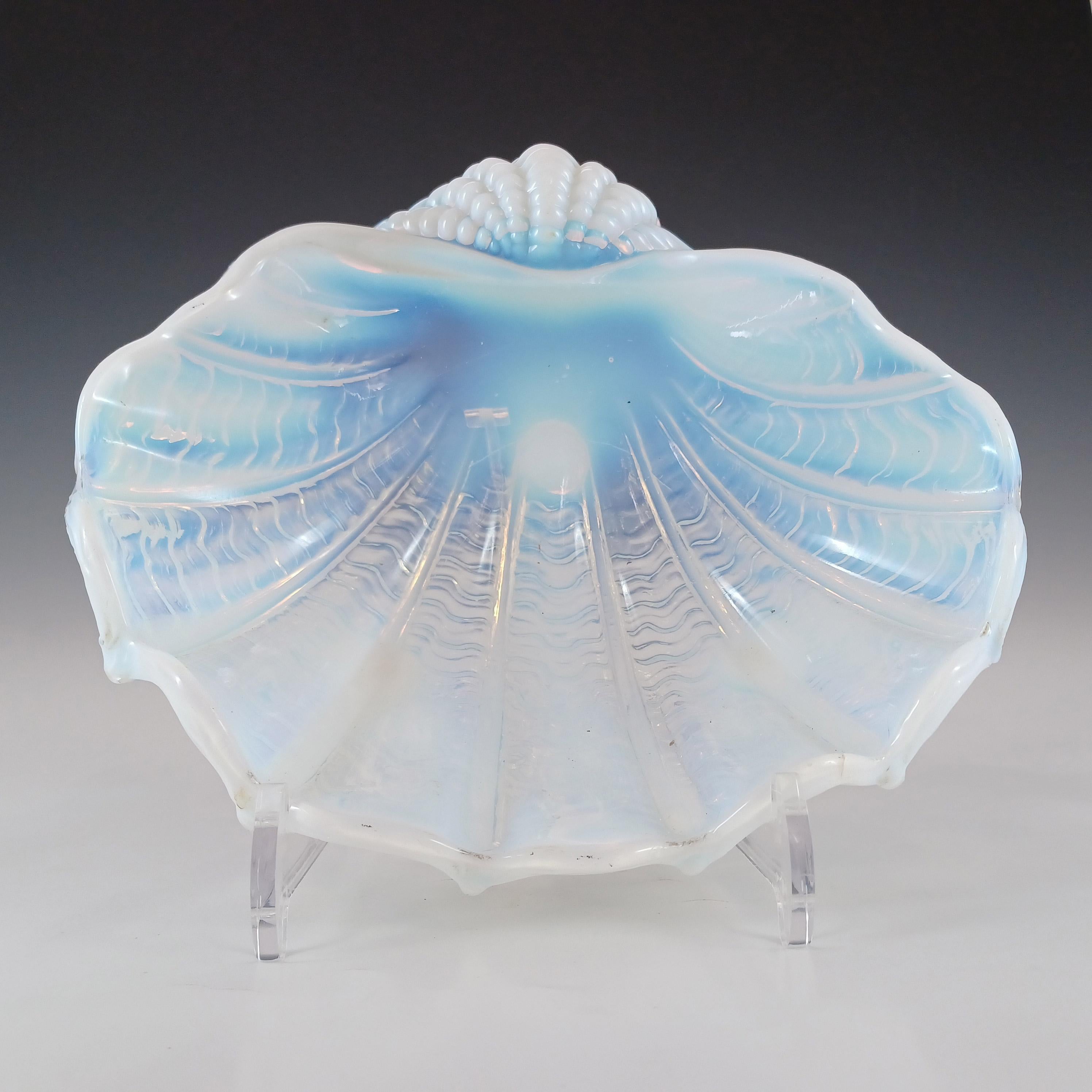 A wonderful and rare (only one I have ever seen) art deco or earlier glass clam shell shaped bowl/dish, made in opaline/opalescent glass. Manufacturer unknown, thought to be British.

Please note: the plastic stand is for display purposes only and