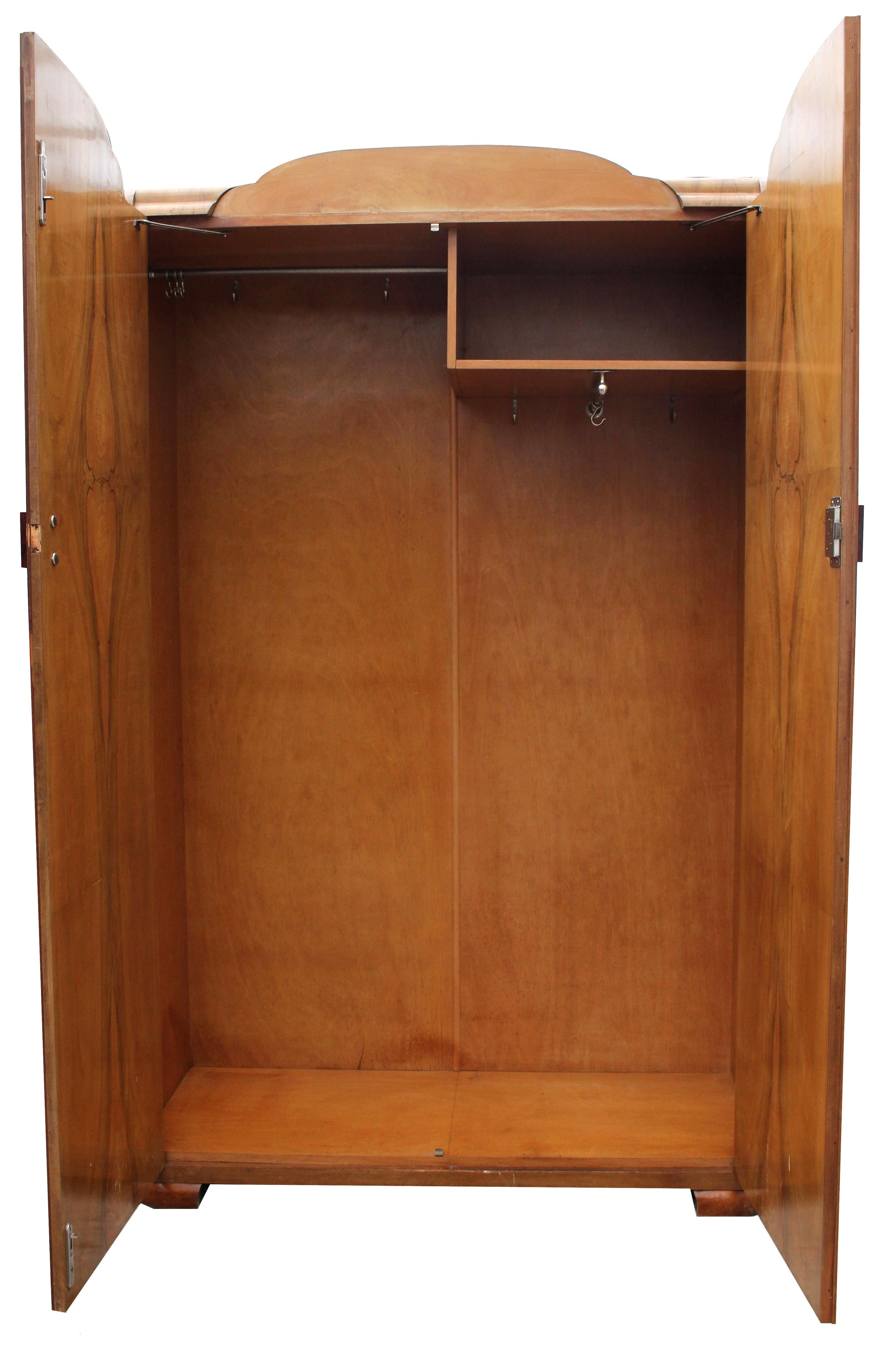 For your consideration is this extremely stylish and very attractive English Art Deco heavily figured Walnut two-door wardrobe, dating to the 1930s with all original fixtures and fittings. Not only does this wardrobe look the part but it's extremely