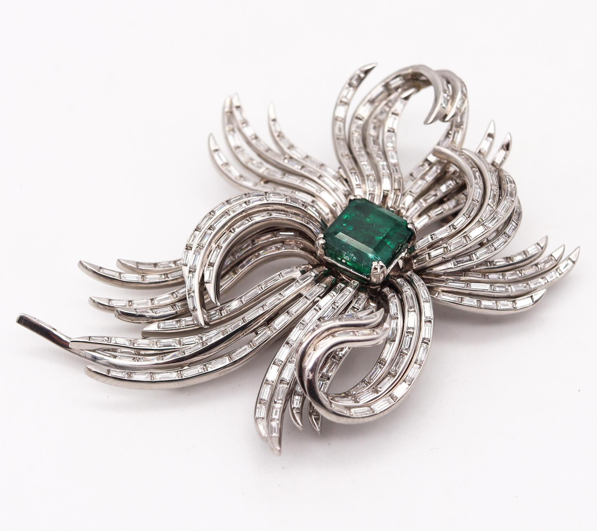 An art deco brooch with diamonds and emeralds.

Magnificent piece of jewelry, created during the late art deco period, back in the 1935. This fabulous gems-set brooch has been carefully assembled with multiples parts crafted in solid platinum