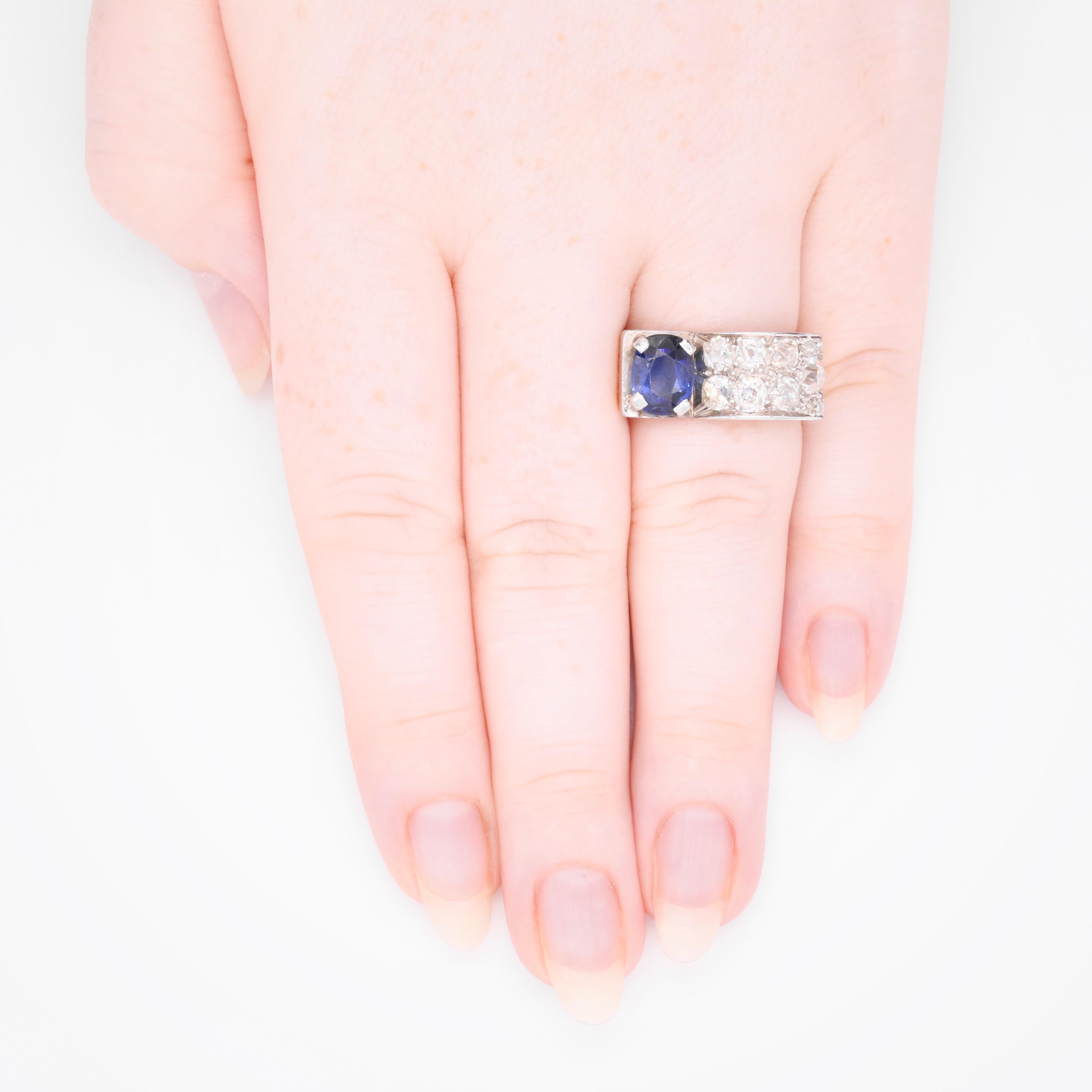 An Art Deco sapphire, diamond, platinum, and yellow gold ring, comprising one oval cut blue sapphire, and eleven old mine cut and Peruzzi cut diamonds, set in platinum, to a band of 18 karat yellow gold.

This ring is in the statement ‘odeonesque’