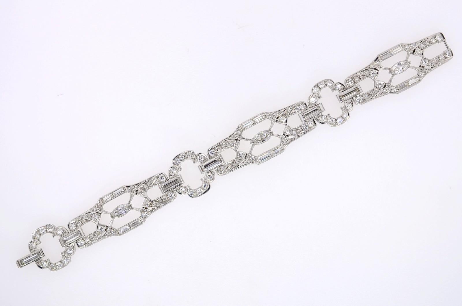 This exceptional, one-of-a-kind antique Platinum bracelet is of unusual design. Approx. 9.00 carat of H-I/VS shimmering white Diamonds make this a stand-out piece. Created in the 1940s, it is of Art Deco design and encrusted with large Baguette and