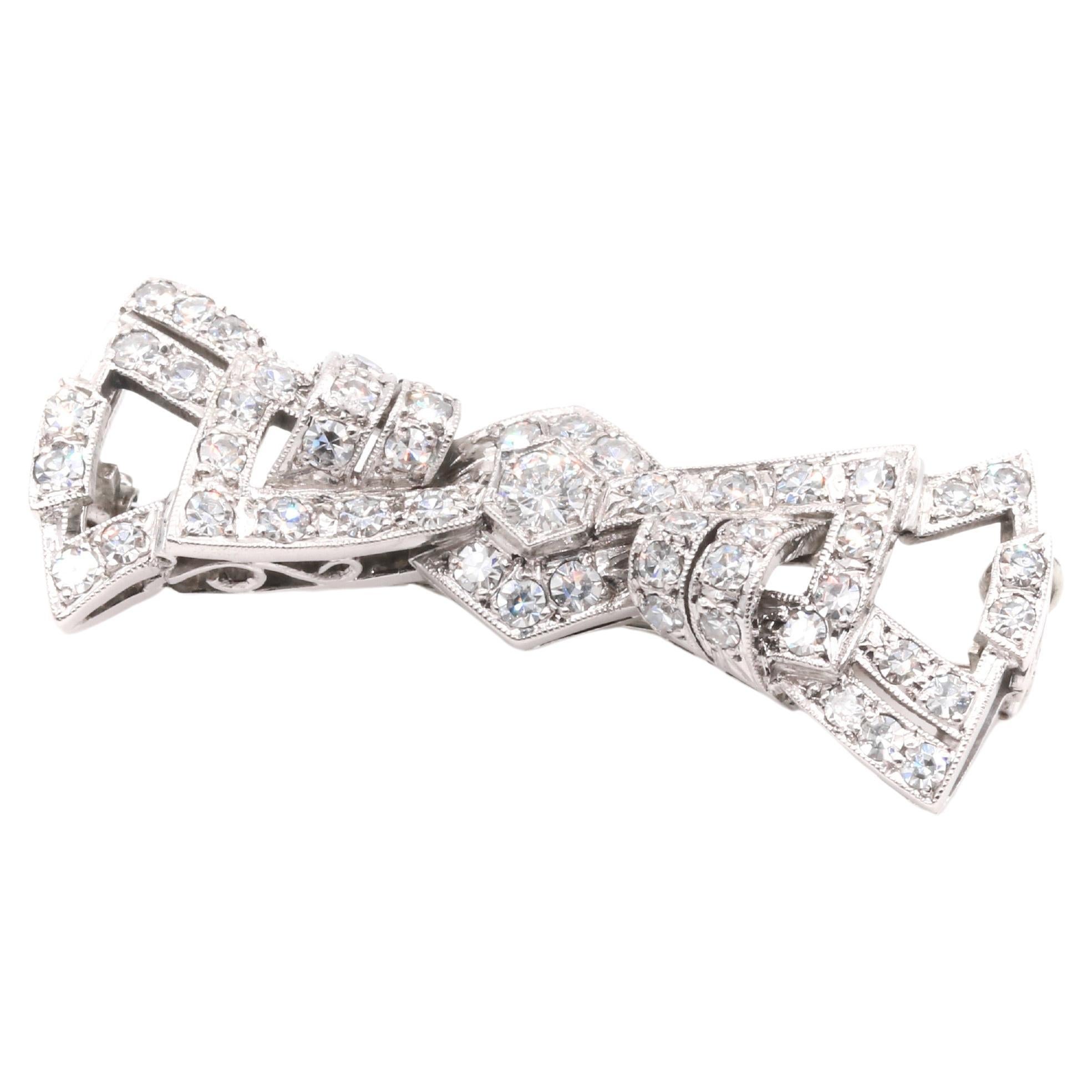 Art Deco 1940s Palladium Diamond Stylised Bow Brooch For Sale