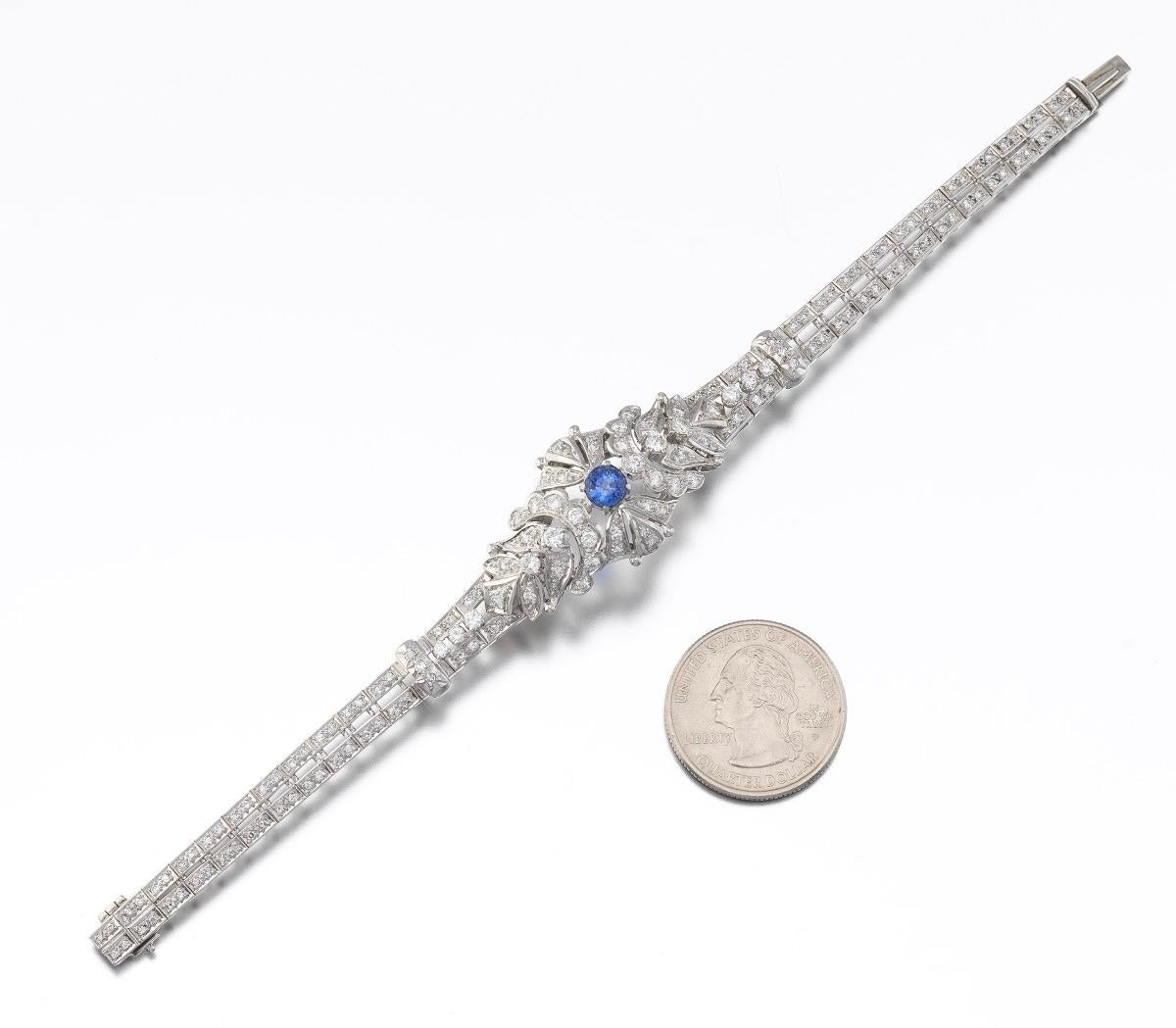 Gorgeous Art Deco platinum retro style bracelet with slide-in clasp and safety catch; set with central round cut natural blue sapphire, estimated weight 1.02 carats, and further accented with 157 round brilliant and single cut diamonds, total