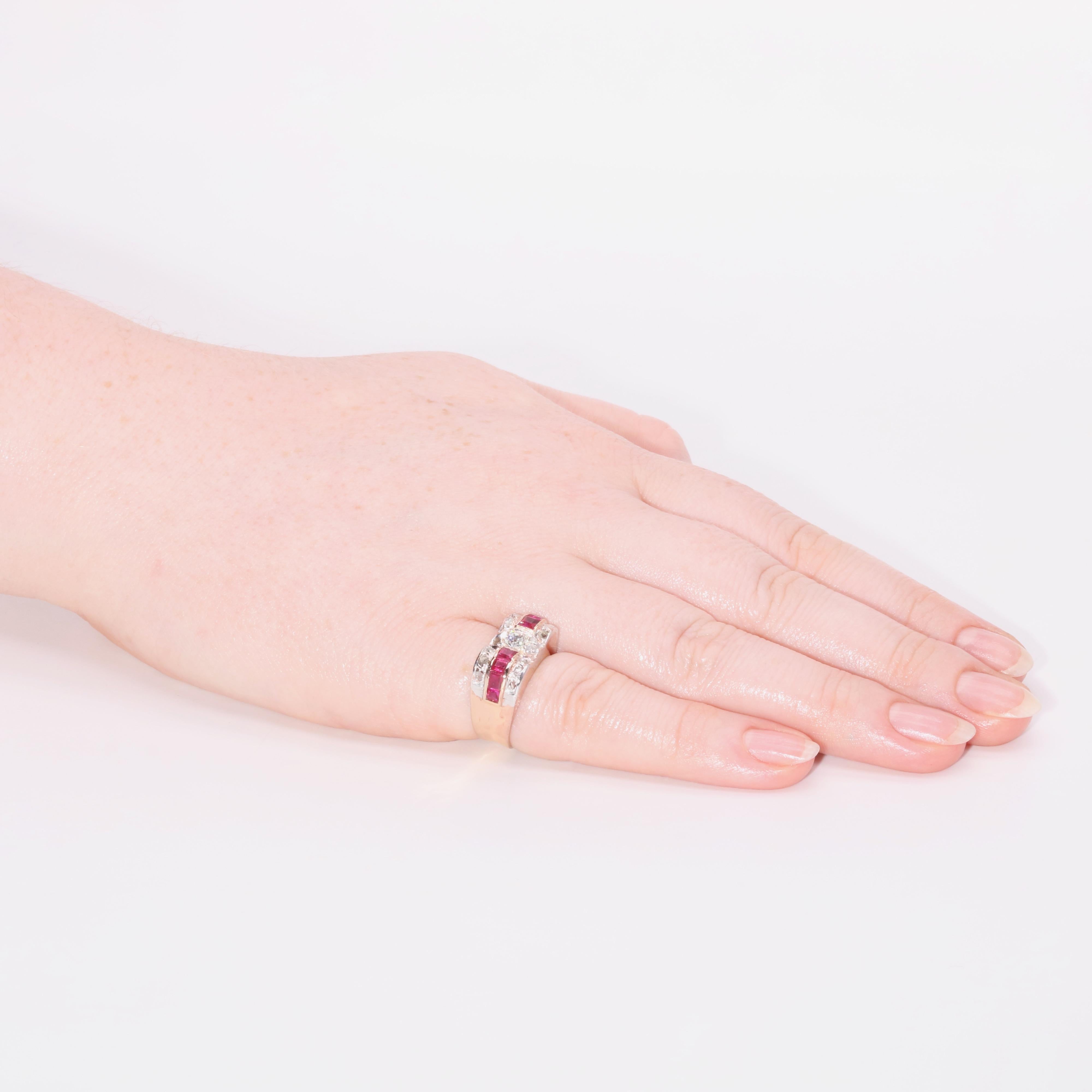 An Art Deco diamond, ruby, platinum, and rose gold ring, comprising one large old European cut diamond, sixteen smaller rose cut diamonds, and eight square and rectangular cut rubies, set in platinum, to a 14 karat rose gold band.

This sensational