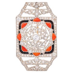 Broche Art déco en or jaune 18 carats, poids total de 1,95 carat, diamant, corail, onyx et platine