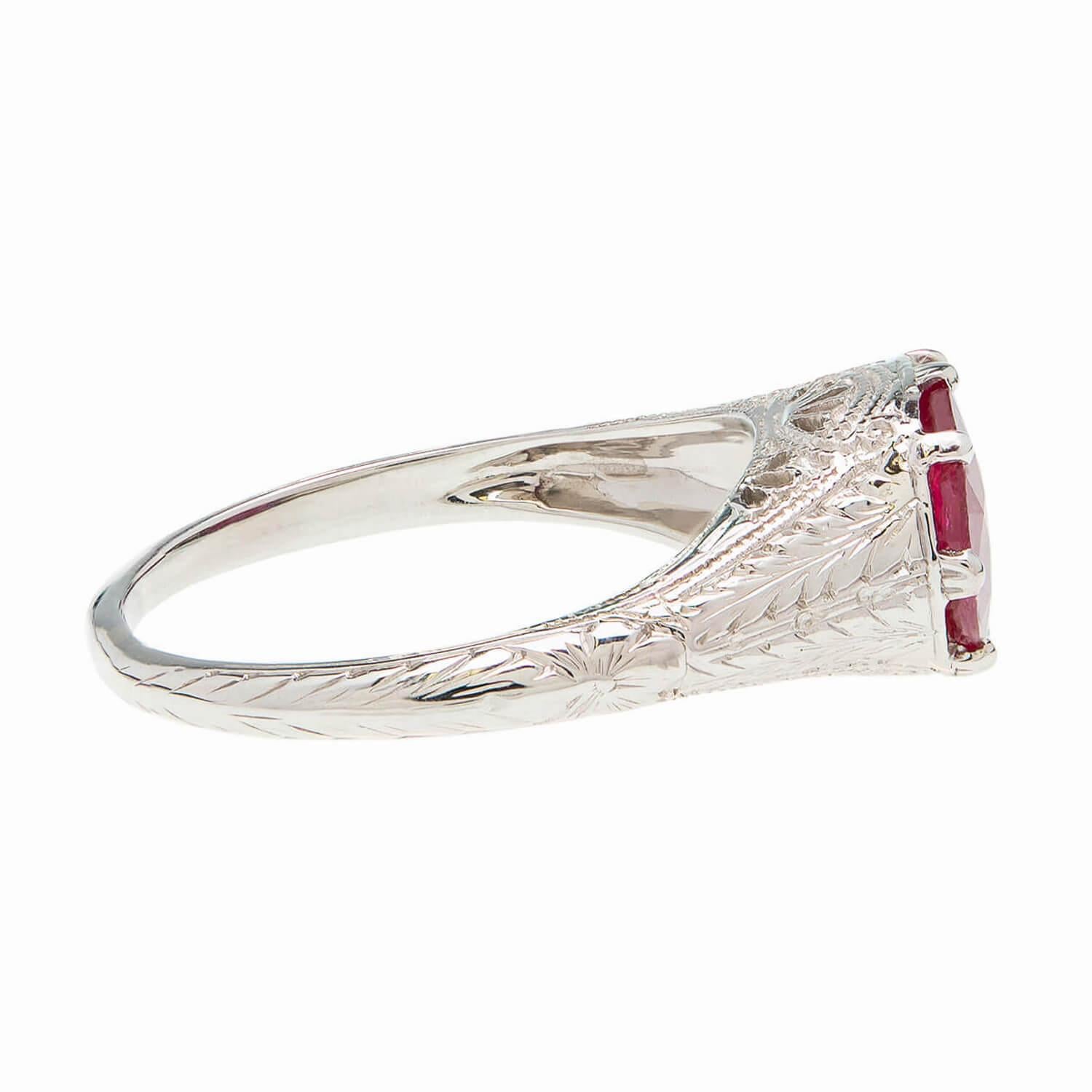 An unusual gemstone ring from the Art Deco (ca1920s) era! Crafted in 19k white gold, this beautiful ring frames a 2.51ct solitaire ruby at the center of a filigree mounting. The gorgeous ruby is polished into a faceted oval shape, displaying a
