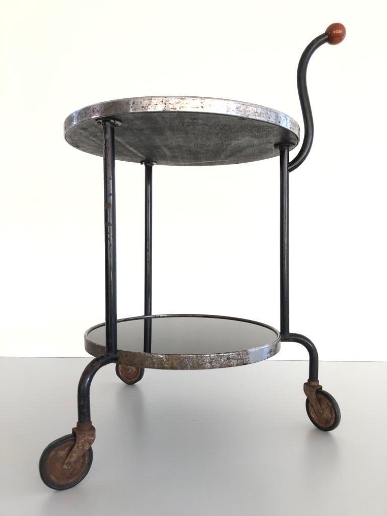 Art Deco 2-layer Glass rare Rolling Bar Cart with ball top handle, 1940s

Measurtements :

Height: 58 cm
Height with handle: 79 cm
Diameter top: 44,5 cm
Diameter bottom: 38,5 cm

Please do not hesitate to ask us if you have any questions.