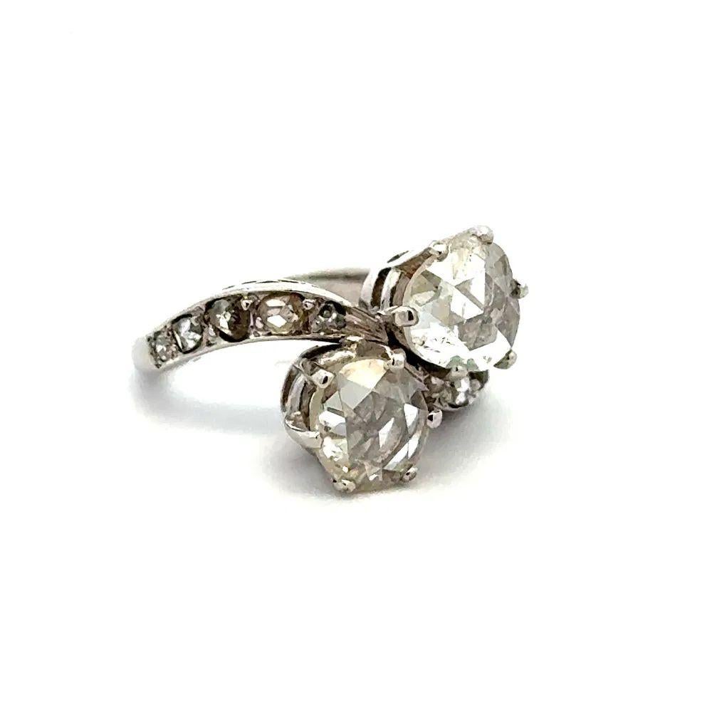 Simply Beautiful! Finely crafted 2 Stone Rose Cut Diamond 'Toi et Moi' 18K White Gold Bypass Ring. Securely Hand set with 2 Diamonds, weighing approx. 1.17tcw. Accented by Diamonds, approx. 0.45tcw. Hand crafted 18K White Gold mounting. Ring size: