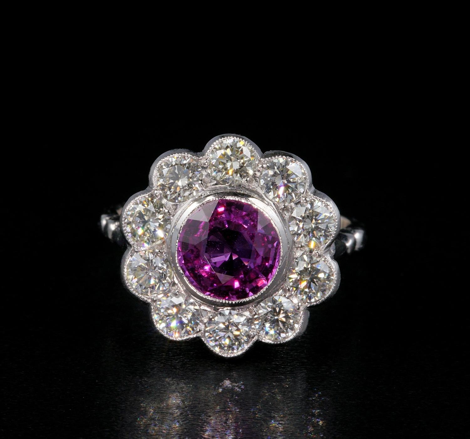 Pink!

A gemmy hot Pink Natural unheated Ceylon Sapphire makes the star of this stunning Art Deco ring, designed in a halo with rich Diamond set like a floret, all superbly hand crafted of solid Platinum – marked.
The ring is of great effect when