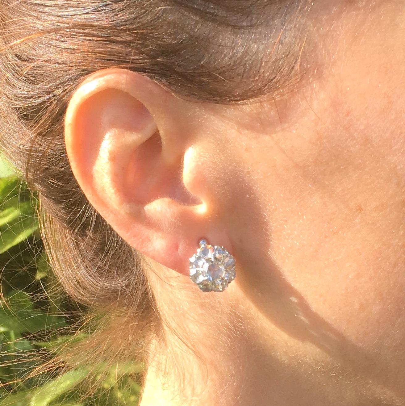 A versatile pair of earrings work just as well when worn formally or casually. Each cluster is holds nine white and lively rose cut diamonds arranged in a round cluster. With pin and hinged back closures.

Cut – Rose cuts.

Colour – G to I.

Clarity