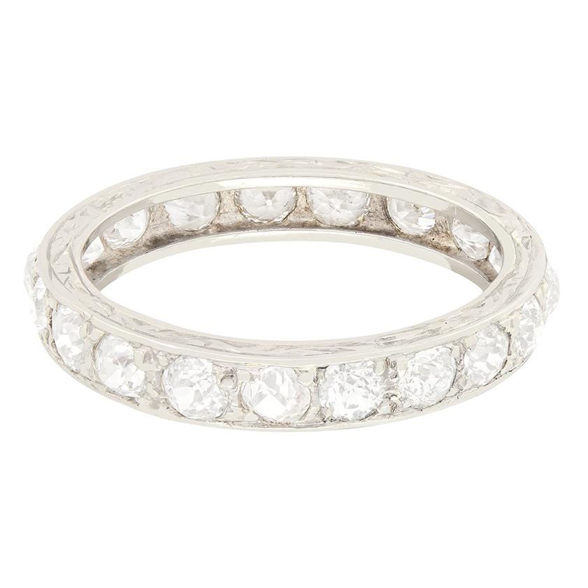 A total of twenty diamonds enrobe this beautiful eternity ring dating to the Art Deco period. Old cut diamonds are delicately grain set into platinum, each weighing 0.10 carat for a total of 2.00 carat. Each diamond ranges in colour from G to H and