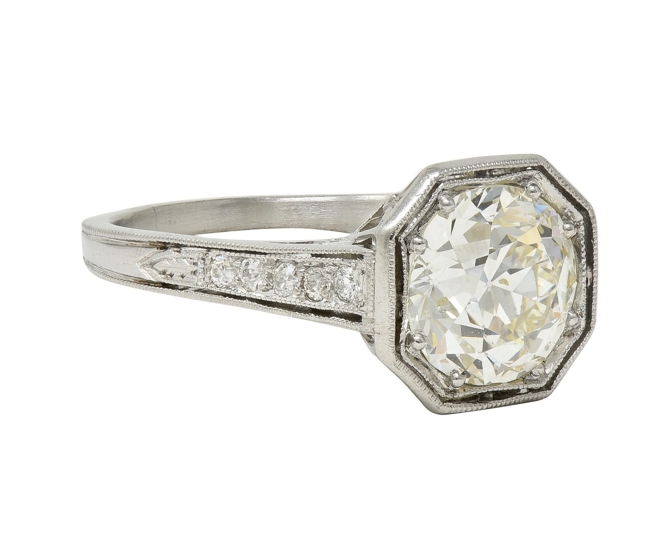 Centering an old European cut diamond weighing approximately 1.91 carats - M color with VS2 clarity
Bead set in an octagonal form head and flanked by pierced cathedral shoulders
Bead set with old European cut diamonds weighing approximately 0.12