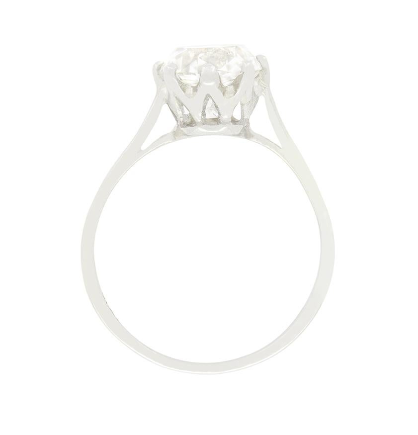 A stunning 2.05 carat old cushion cut diamond is showcased in this timeless 1920s solitaire ring. With colour of I and clarity of VS1 the beautiful white diamond is claw set into an expertly crafted platinum mount. This timeless design sits upon a