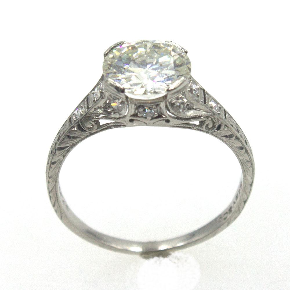 This gorgeous Art Deco Diamond Engagement Ring features a 2.08 carat Old European cut diamond graded K color and VS1 clarity by the GIA. The hand crafted platinum mounting is set with another 10 diamonds for a total of 2.28 ctw. The ring is