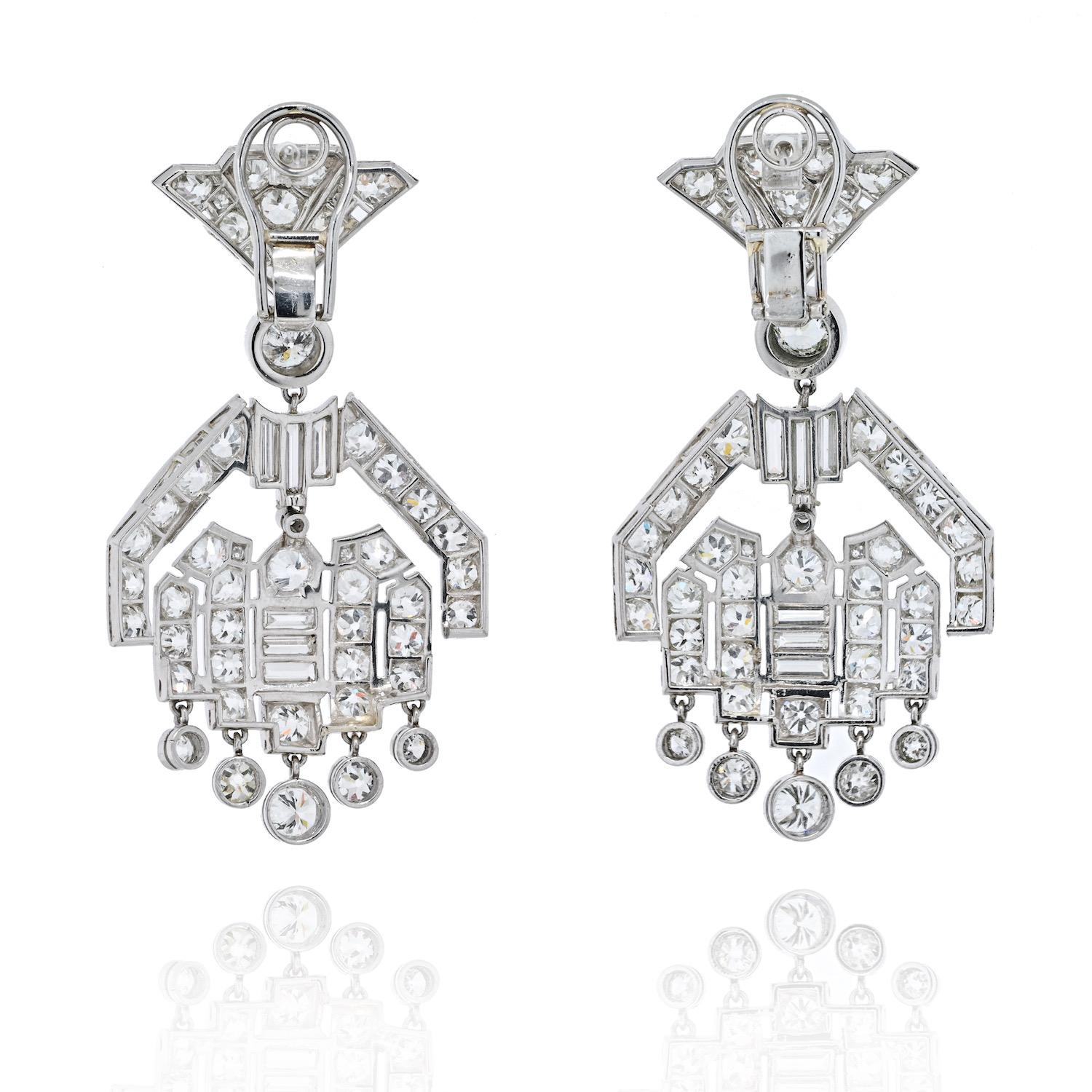 Diamond drop earrings from the Art Deco era are encrusted with 20 carats of old cut diamonds. Measuring about 5cm long these lively dangling earrings are in greate condition and deliver lots of sparkle.  The diamond studded chandeliers give way to