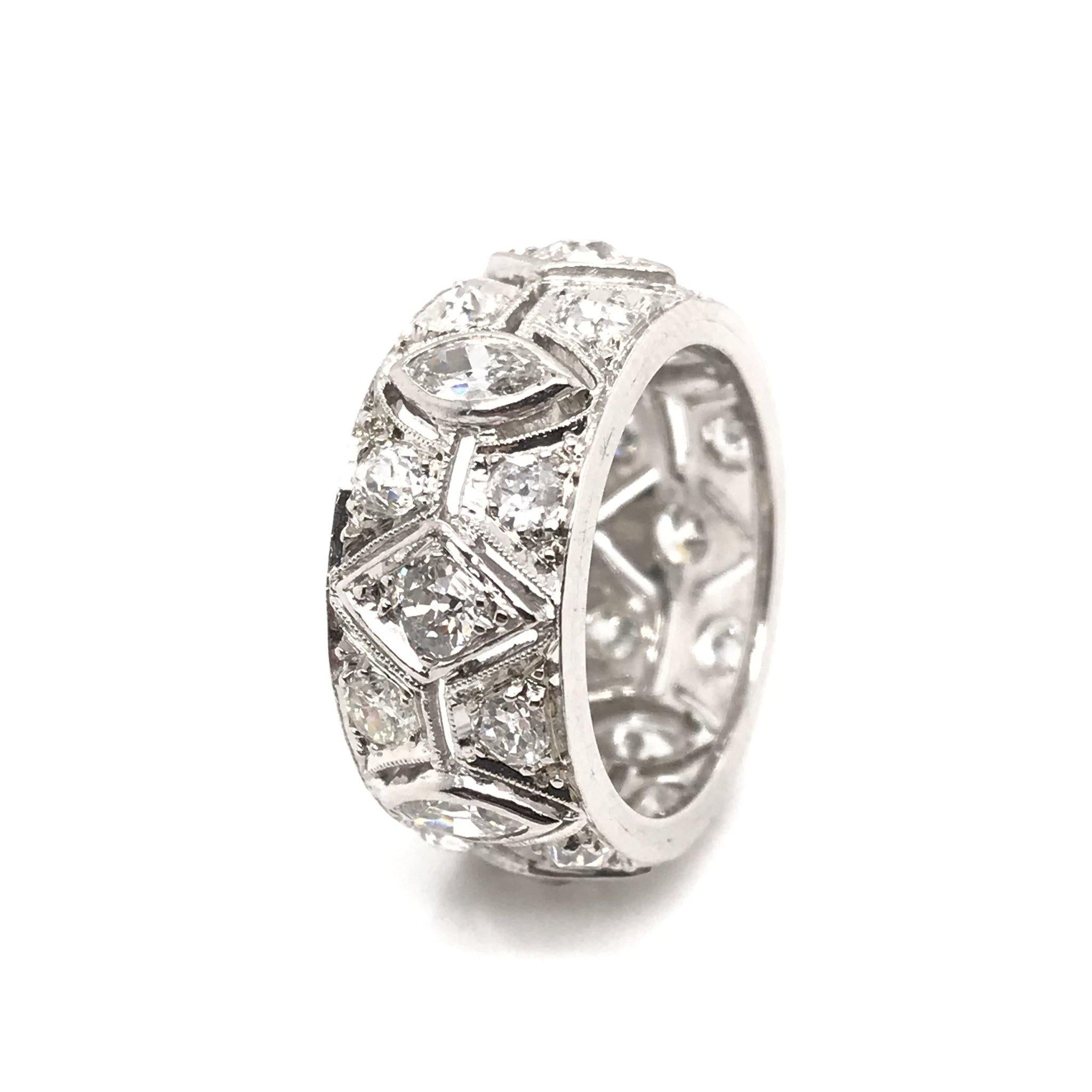 This decadent antique piece was handcrafted sometime during the Art Deco design period ( 1920-1940 ). The platinum setting features 20 sparkling European cut diamonds as well as four beautiful antique marquee cut diamonds. The total combined diamond