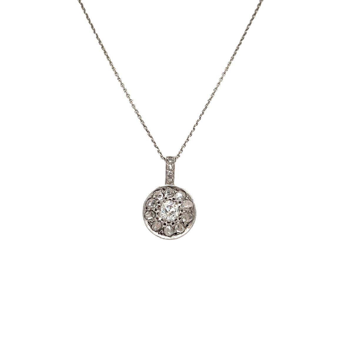 Genuine antique 1930's Art Deco 18k white gold necklace set with one large Old mine cut Diamond in the center, weight 0,90 carat graded I color Vs2 clarity, and surrounded by rose cut diamonds, total weight 1.20 carats.

CONDITION: Pre-owned -
