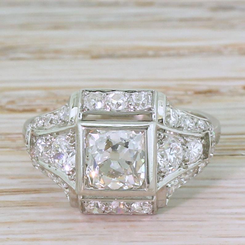 They simply don’t make jewellery like this anymore. This breathtaking Deco diamond ring features a 1.33 carat old mine cut diamond – graded by HRD Antwerp as I colour, SI2 clarity – set within a square, rubover collet. The wonderful surround