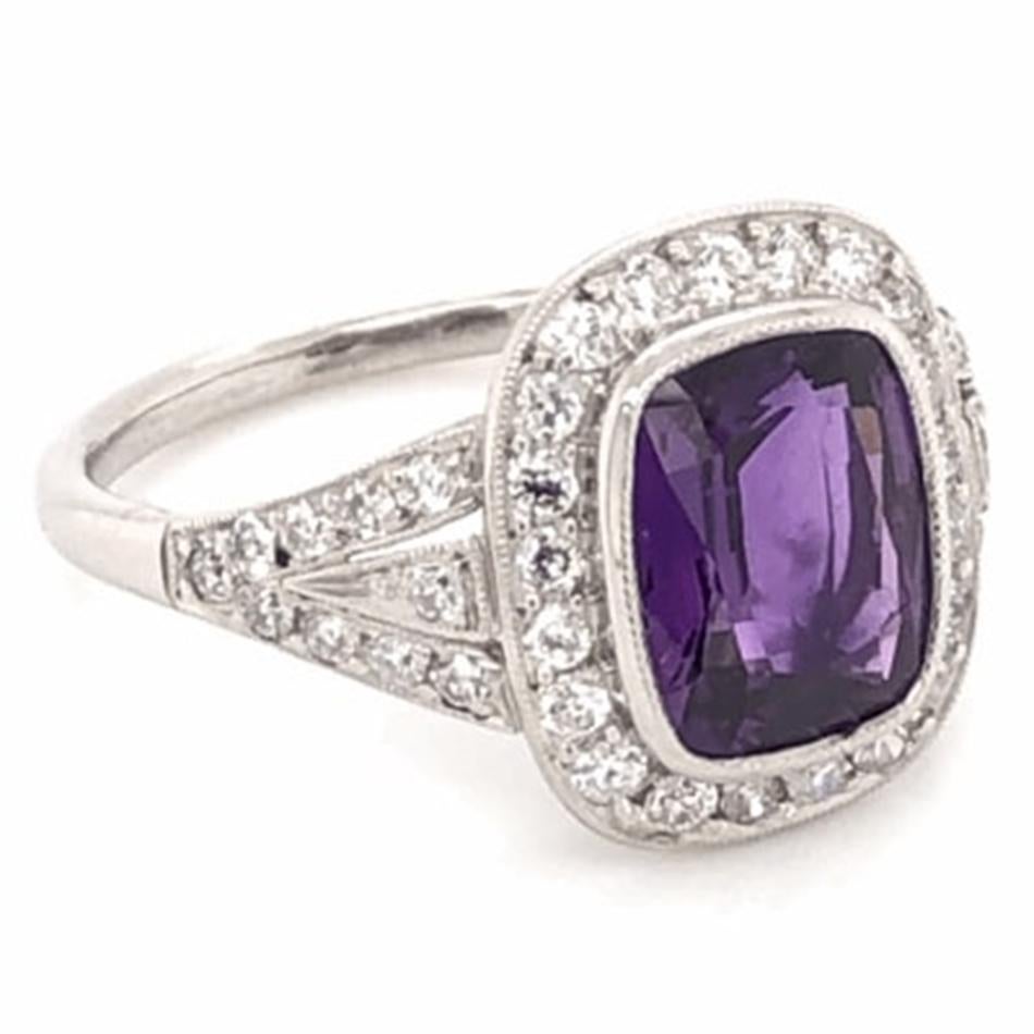 Elegant & finely detailed  Platinum Ring, center set with a securely nestled 2.12 Carat Purple Sapphire, surrounded by and enhanced on shank with full cut Diamonds, weighing approx. .50 total carat weight. Beautifully Hand crafted in Platinum. The