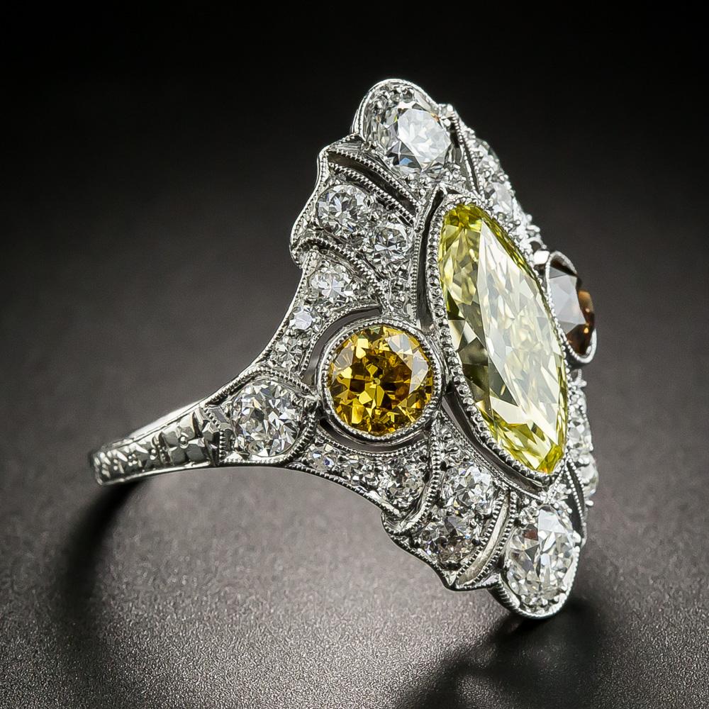 Behold one of the finest, most fabulous, and strikingly stunning Art Deco masterpieces we've had the privilege and pleasure to offer for sale. A resplendent rich sunshiny yellow European-cut marquise diamond (aka Moval, due to its rounded tips),