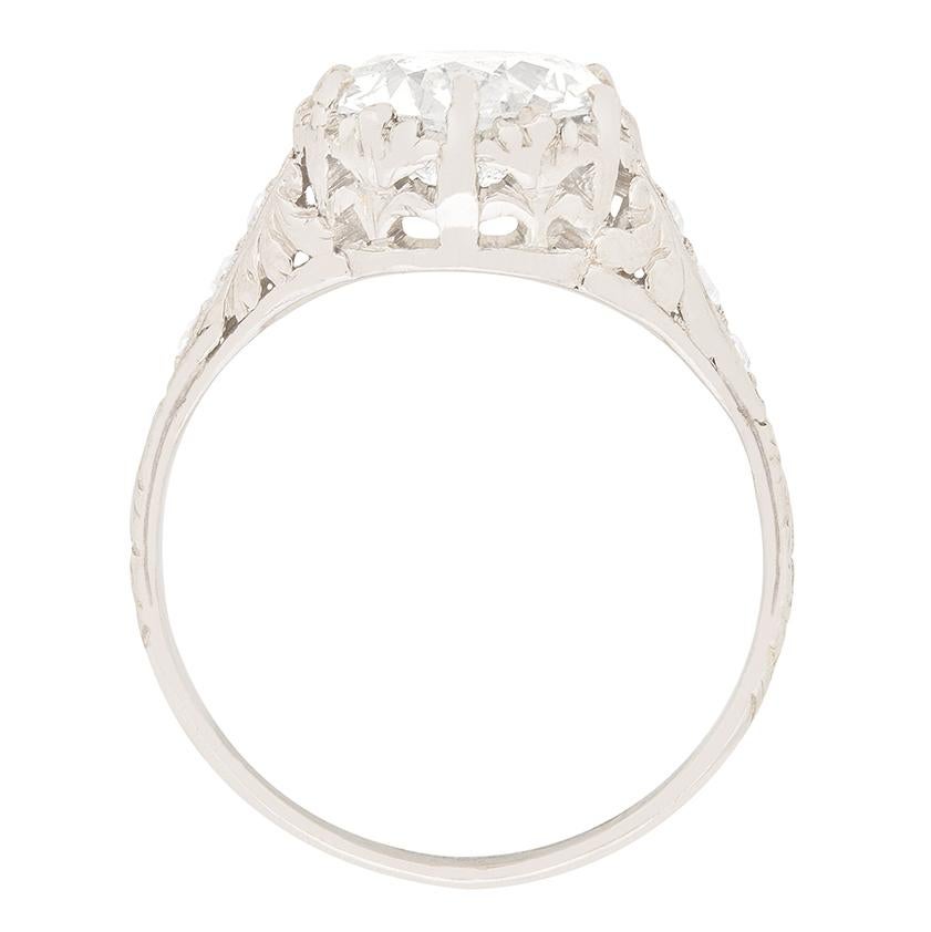 A stunning 2.12 carat old cut diamond is the centre of this beautifully made art deco ring. The diamond would have been cut by hand, and is graded as H in colour and SI2 in clarity. It reflects light wonderfully, giving the ring great liveliness. 