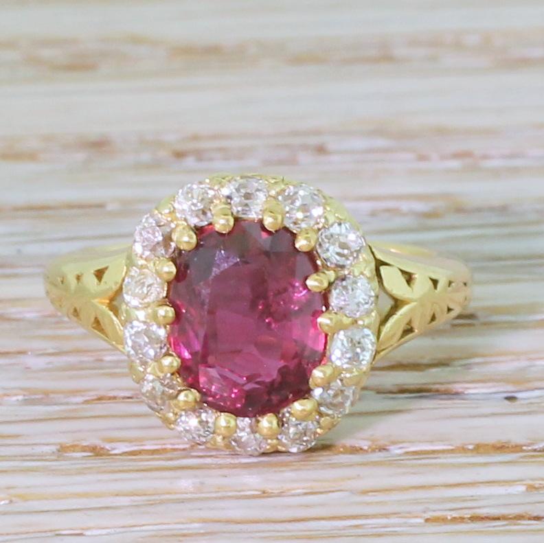 A vintage ruby and diamond ring that really hits the right notes. The natural ruby in the centre – of Thai origin in our opinion – is a gorgeous, deep and vibrant pigeon blood red. Fourteen high white and lively old cut diamonds surround the centre