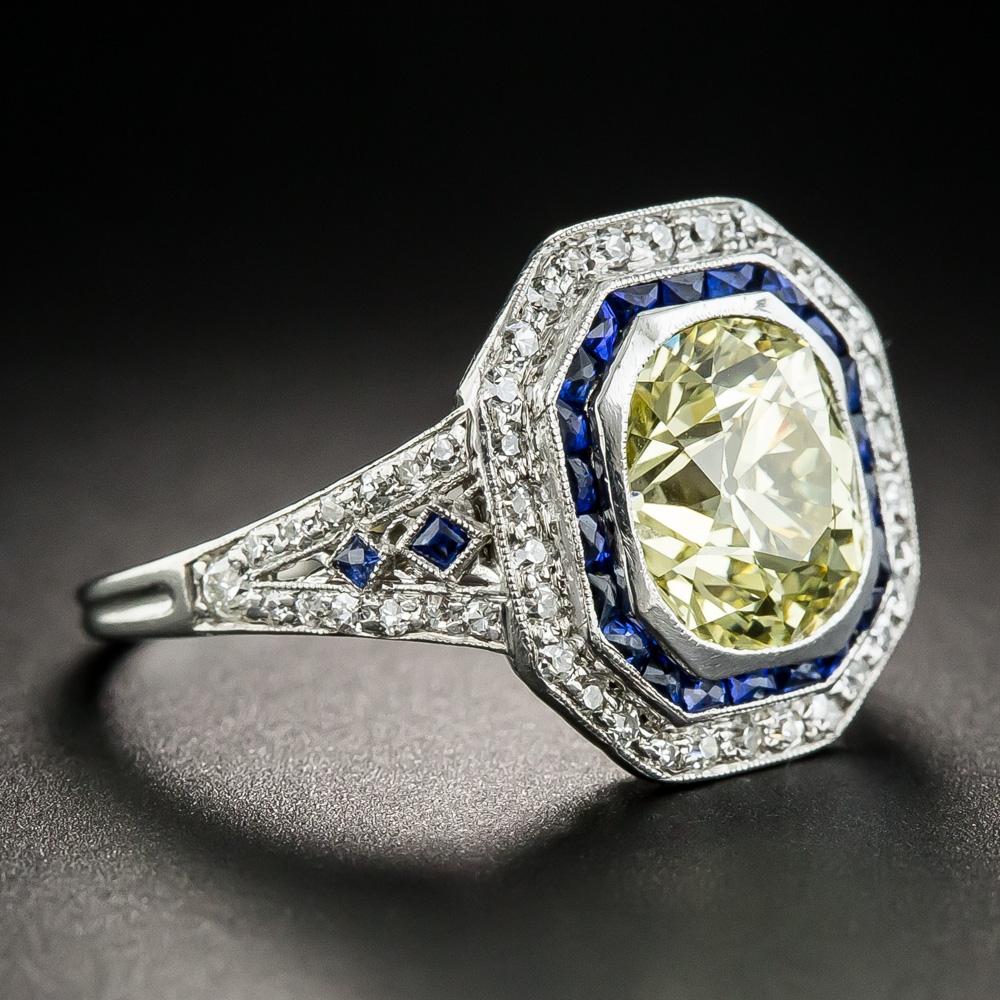 Hailing from the height of the Art Deco period, circa 1925, this fabulous trophy ring stars a resplendent, rich sunshiny fancy yellow antique cushion-cut diamond weighing 2.18 carats, Accompanied by a GIA Diamond Grading Report stating: Fancy Yellow
