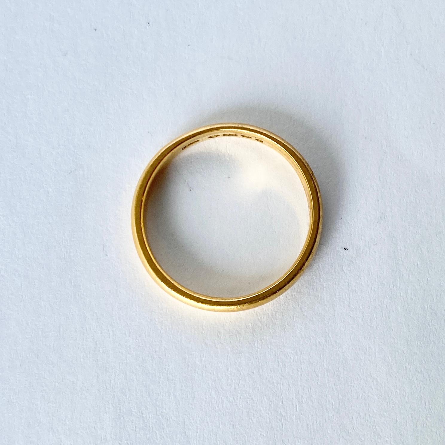 This classic 22ct gold band could be used as a wedding band or a simply lovely everyday ring. Hallmarked Birmingham 1923.

Ring Size: N or 6 3/4 
Band Width: 3mm

Weight: 3.3g