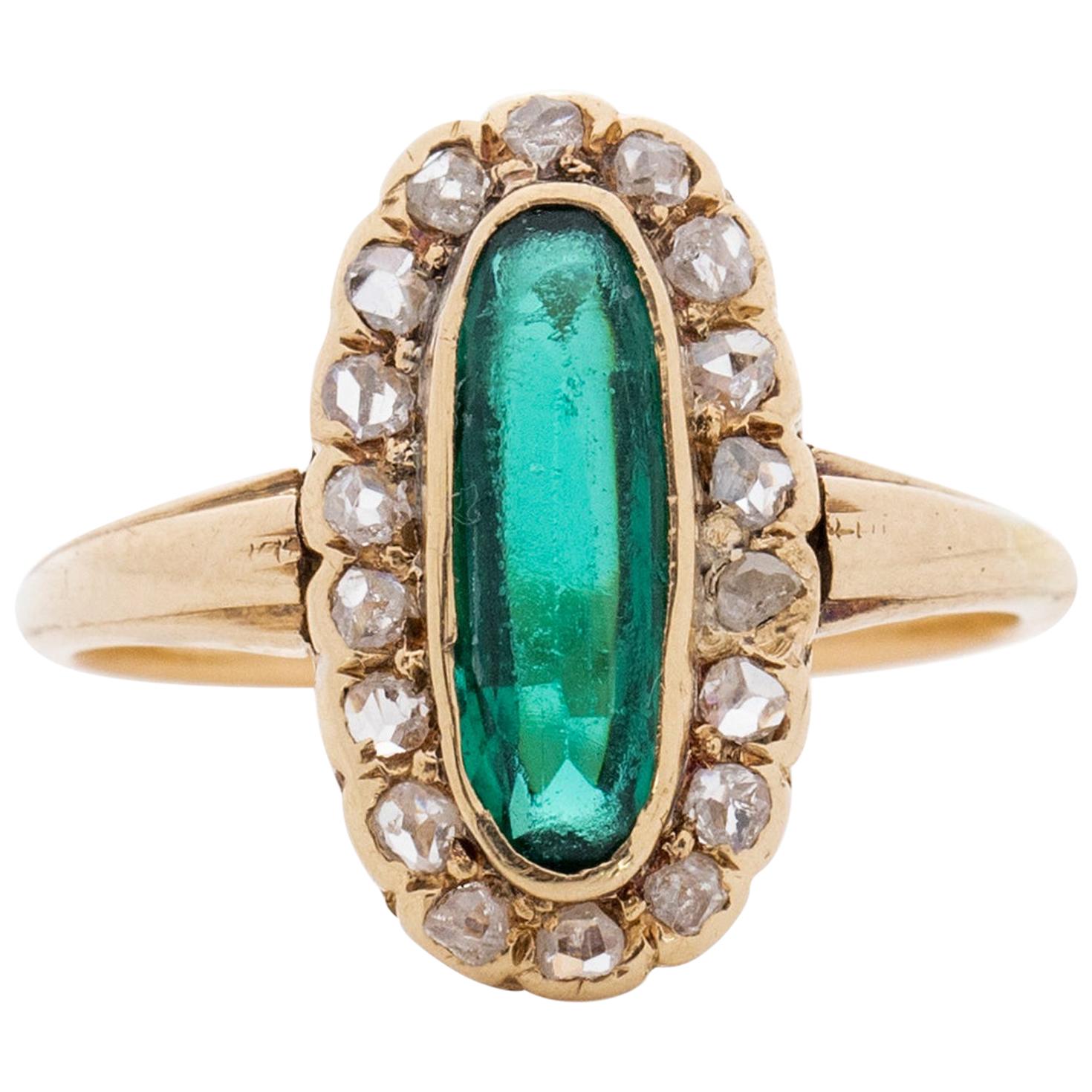 Art Deco 22 Karat Gold Elongated Vibrant Green Gem with a Diamond Halo Ring For Sale