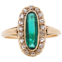 Antique Art Deco 22 Karat Gold Elongated Vibrant Green Gem with a Diamond Halo Ring