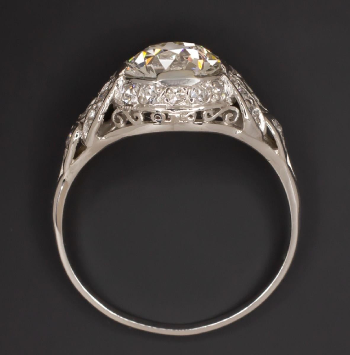 Art Deco style engagement ring features a phenomenally brilliant and high quality 1.86ct old European cut diamond complemented by a richly detailed diamond encrusted platinum setting. The 1.86ct certified center diamond is impressively large,