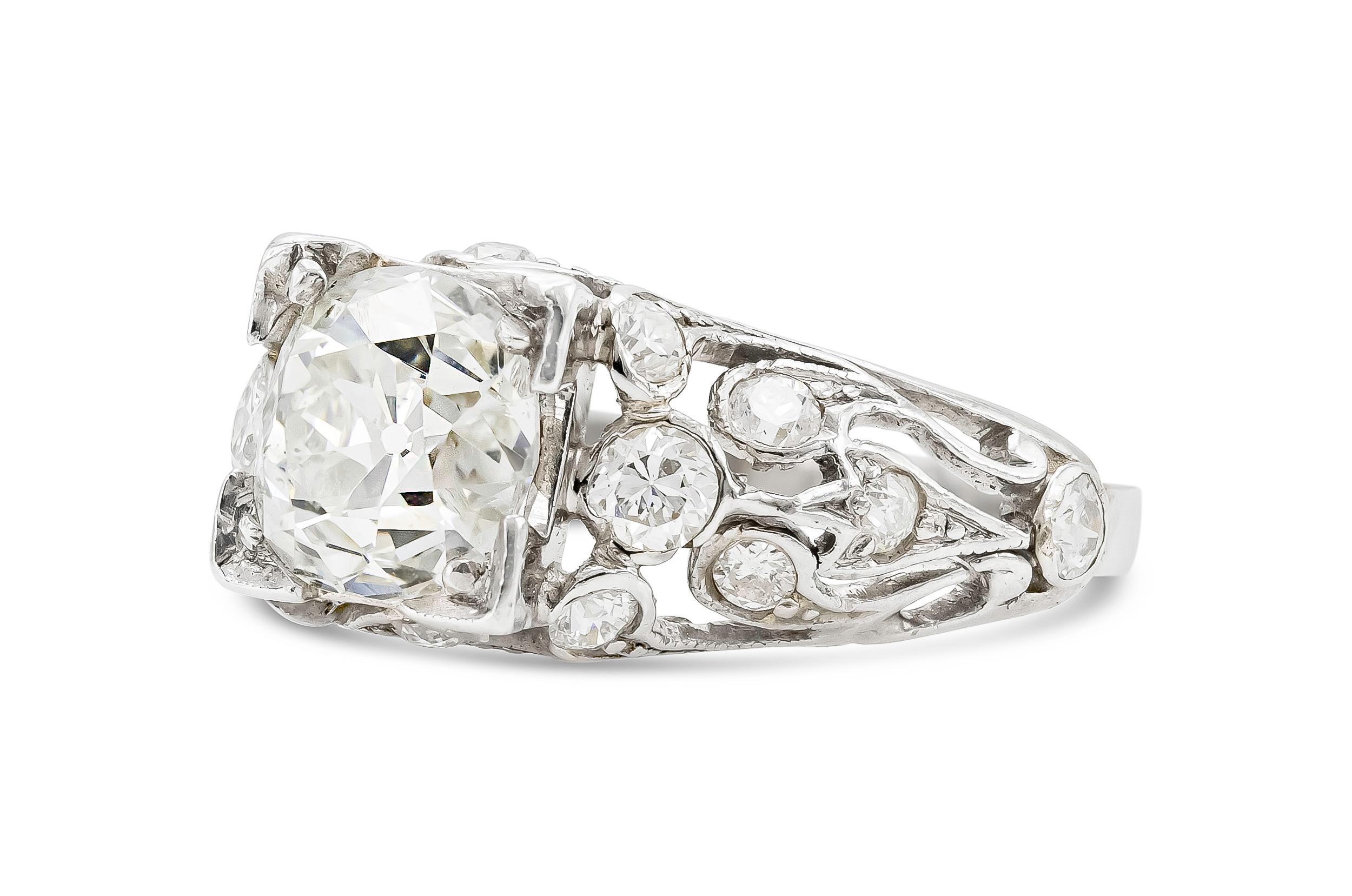 Finely crafted in platinum with an Old Mine cut center Diamond weighing  2.20 carats.
The setting features an additional 0.70 carats of diamonds.
Size 5 3/4, resizable
Art deco, circa 1920s