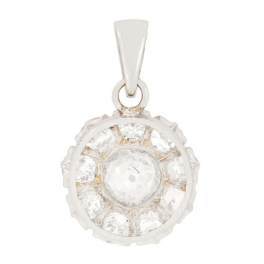 Dating back to the 1920s is this classy diamond cluster pendant. To the centre sits an 0.85 carat old cut with nine smaller old cuts surrounding. The surrounding smaller old cuts total to 1.35 carat, all delicately claw set in 18ct white gold. All