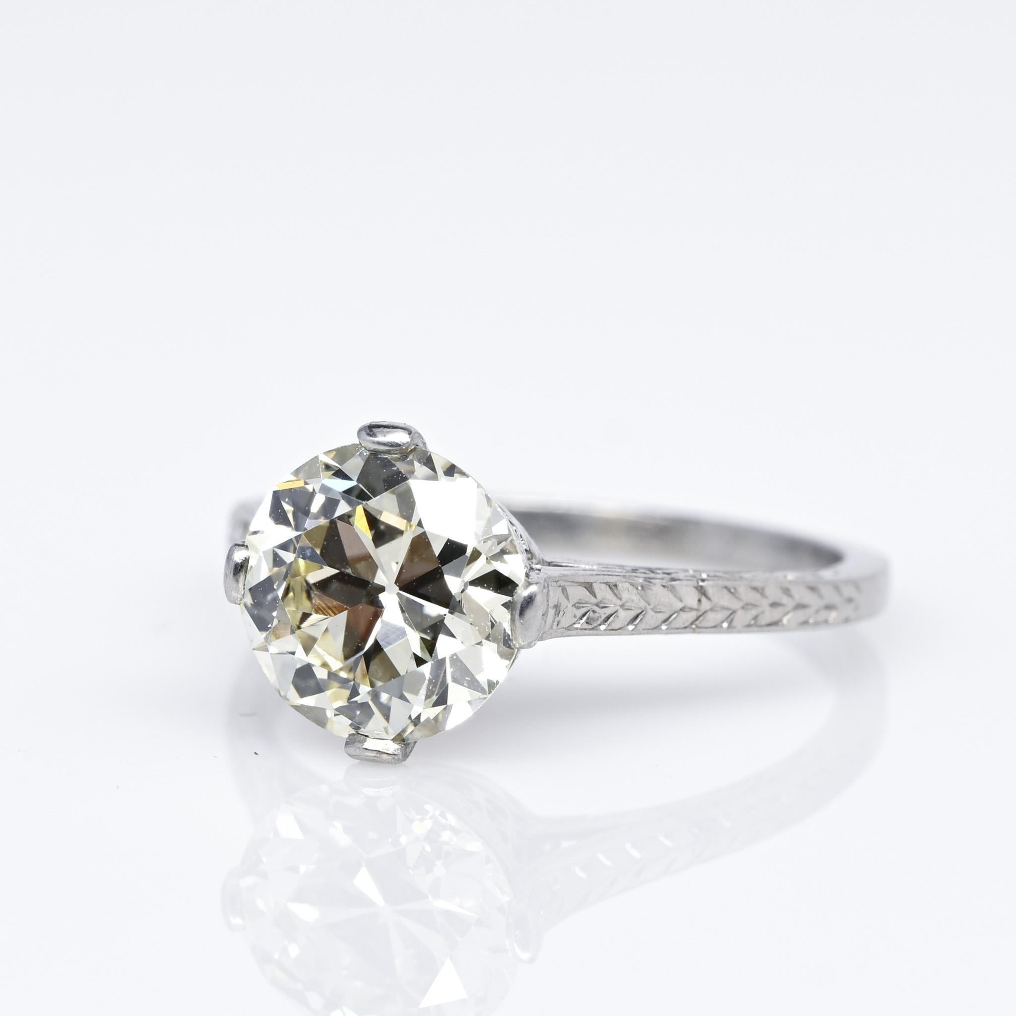 Presenting a splendid illustration of an Art Deco era solitaire engagement ring! This authentic ring from the 1920s showcases a remarkable 2.22-carat old European cut diamond of exceptional VS2 quality. The diamond is exquisitely placed within a