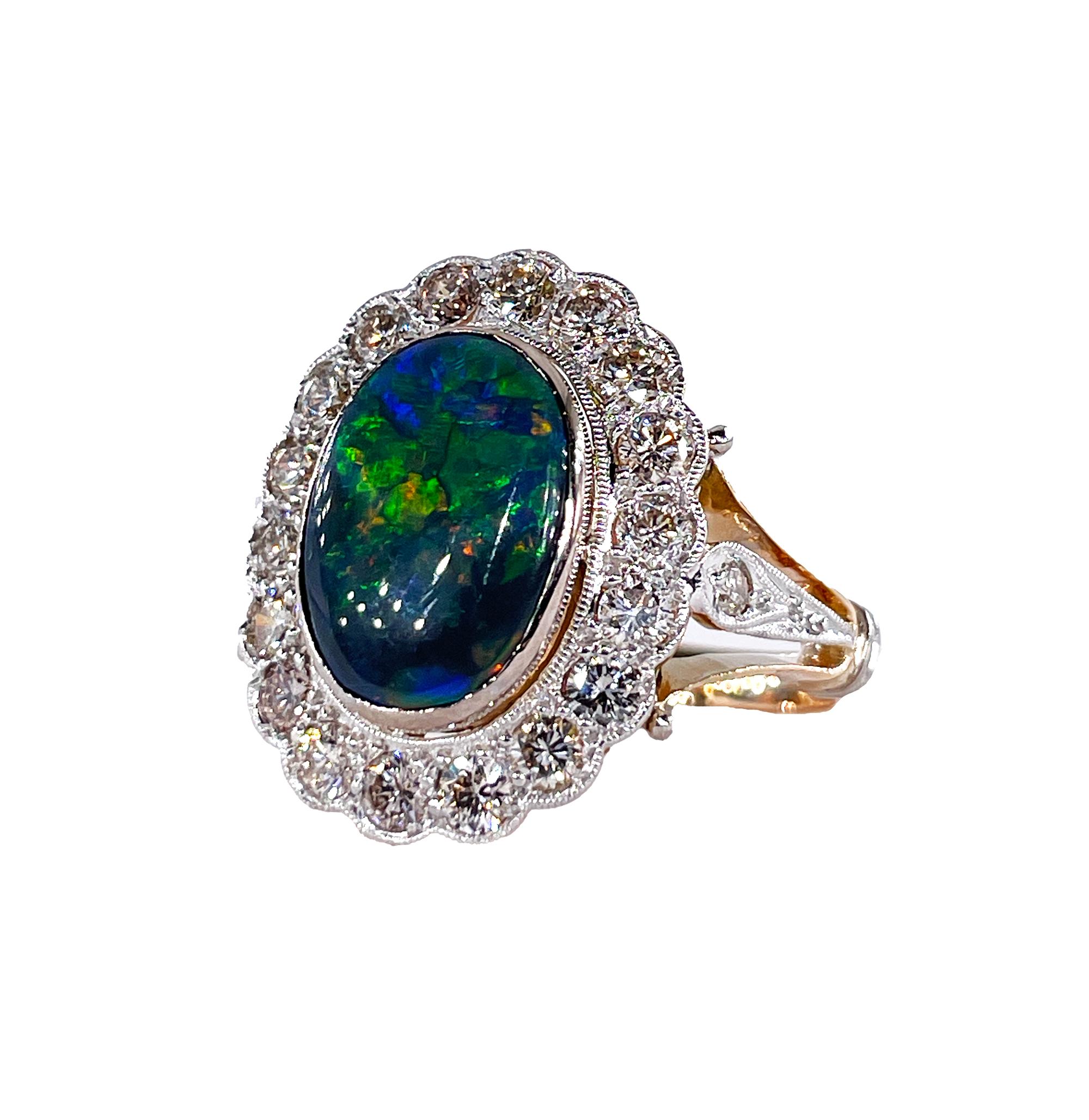 A Beautiful Art Deco Black Australian Opal and Diamond Cluster Flower shaped Ring in 18K Gold

Highly prized and sought after by kings, emperors, maharajas and sultans, the majestic Opal has been desired throughout the ages. From our estate