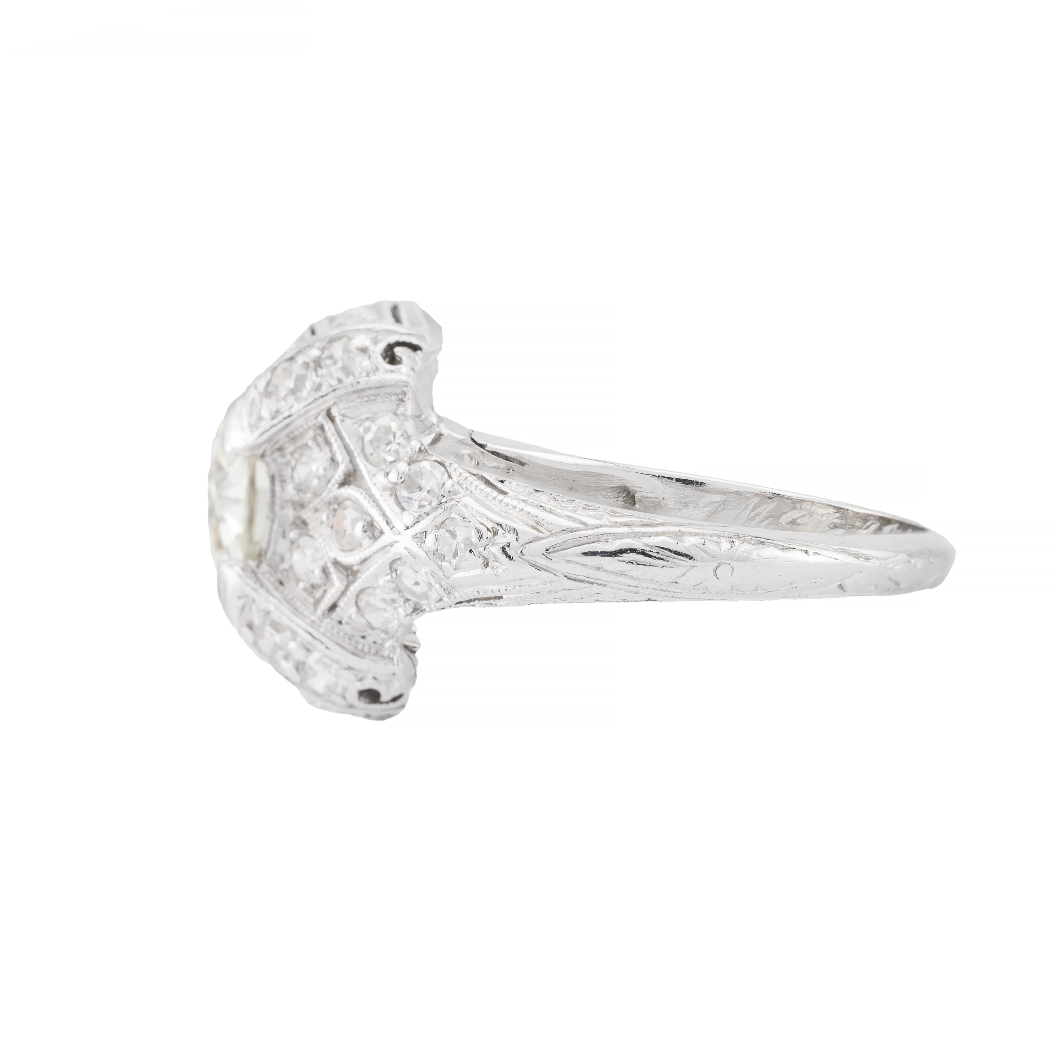Aston Estate Jewelry Presents:

A stunning Art Deco engagement ring in luxurious platinum. Featuring a central European cut diamond, weighing 1.82 carats, with a K color grade and VS1 clarity. The primary stone is surrounded by additional European