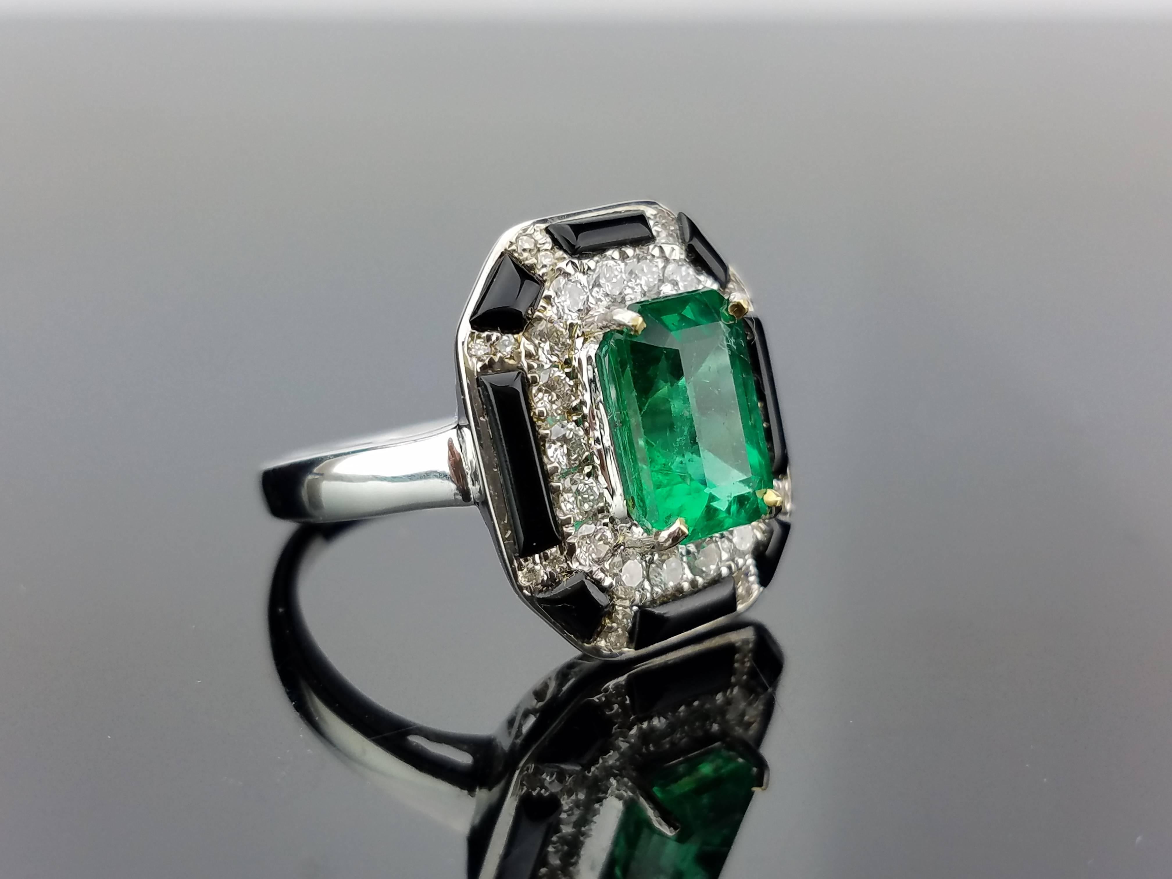 A very contemporary looking cocktail ring, using a Zambian Emerald and diamonds, as well as black enamel - all set in 18K white gold. 

Stone Details: 
Stone: Emerald
Carat Weight: 2.29 carat

Diamond Details: 
Total Carat Weight: 0.50