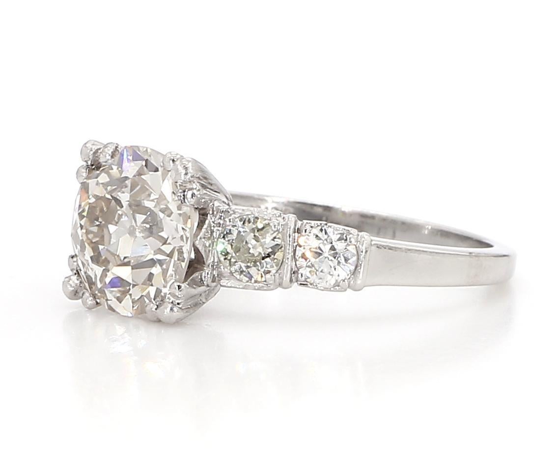 A stunning diamond ring featuring an Old Euro cut diamond weighing 2.3 carats, with a color grade of L and a clarity grade of VS2. The vintage-inspired Old Euro cut provides a unique and timeless look, with its chunky facets giving off a beautiful