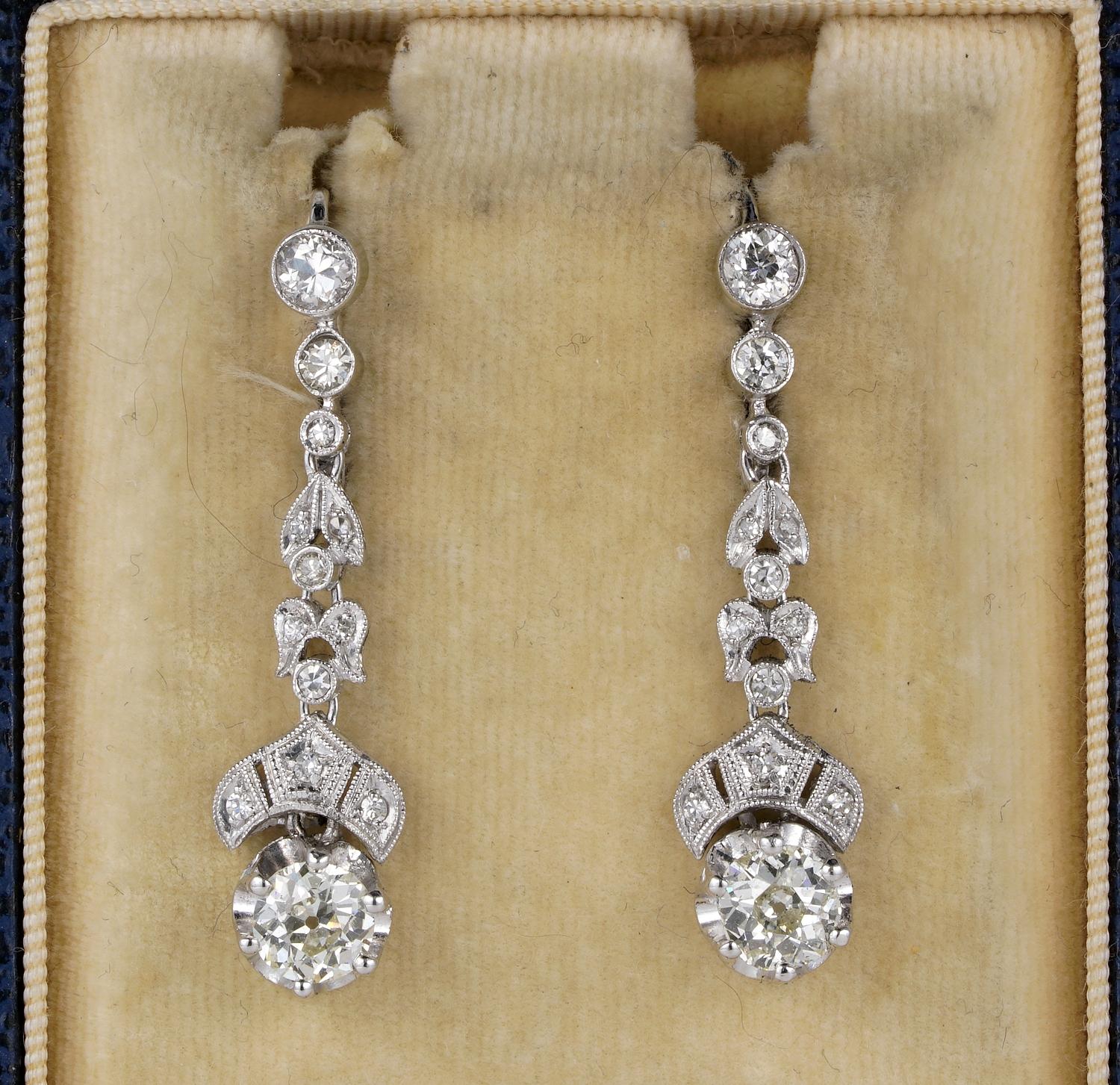 These beautiful swing drop earrings are Art Deco period, 1925 ca
Hand crafted of solid 18 Kt topped by Platinum
Gently mounted in a combination of leaf and lunette design, disposed in a long line of old cut Diamonds, leading to the larger Diamond