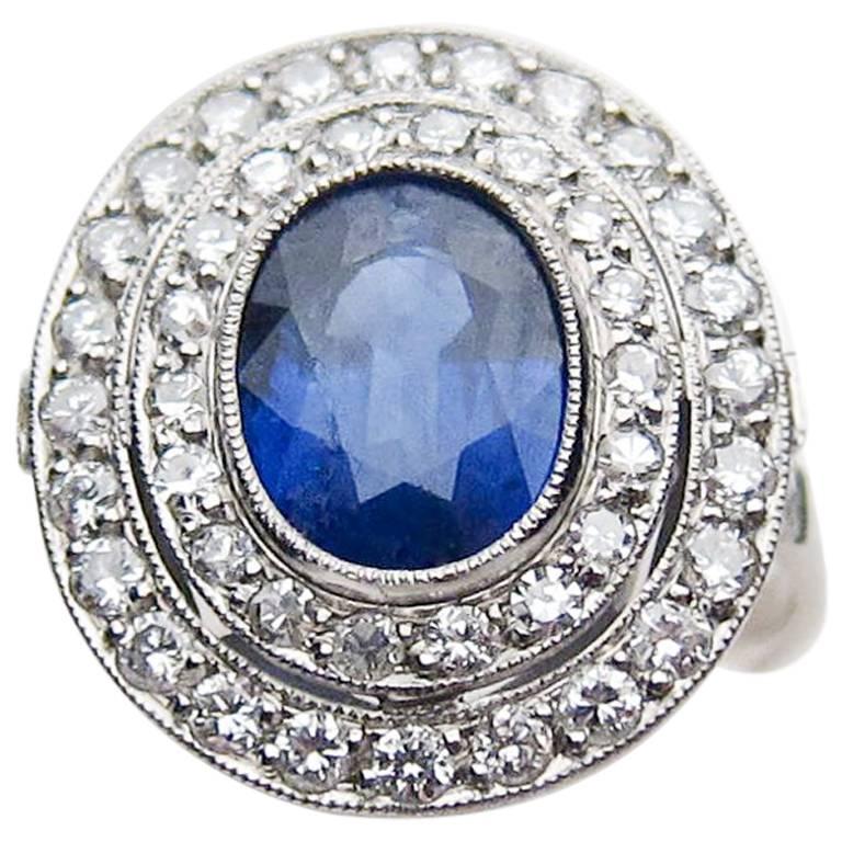 Art Deco 2.36 Carat Natural Blue Sapphire Double Diamond Platinum Halo Ring For Sale