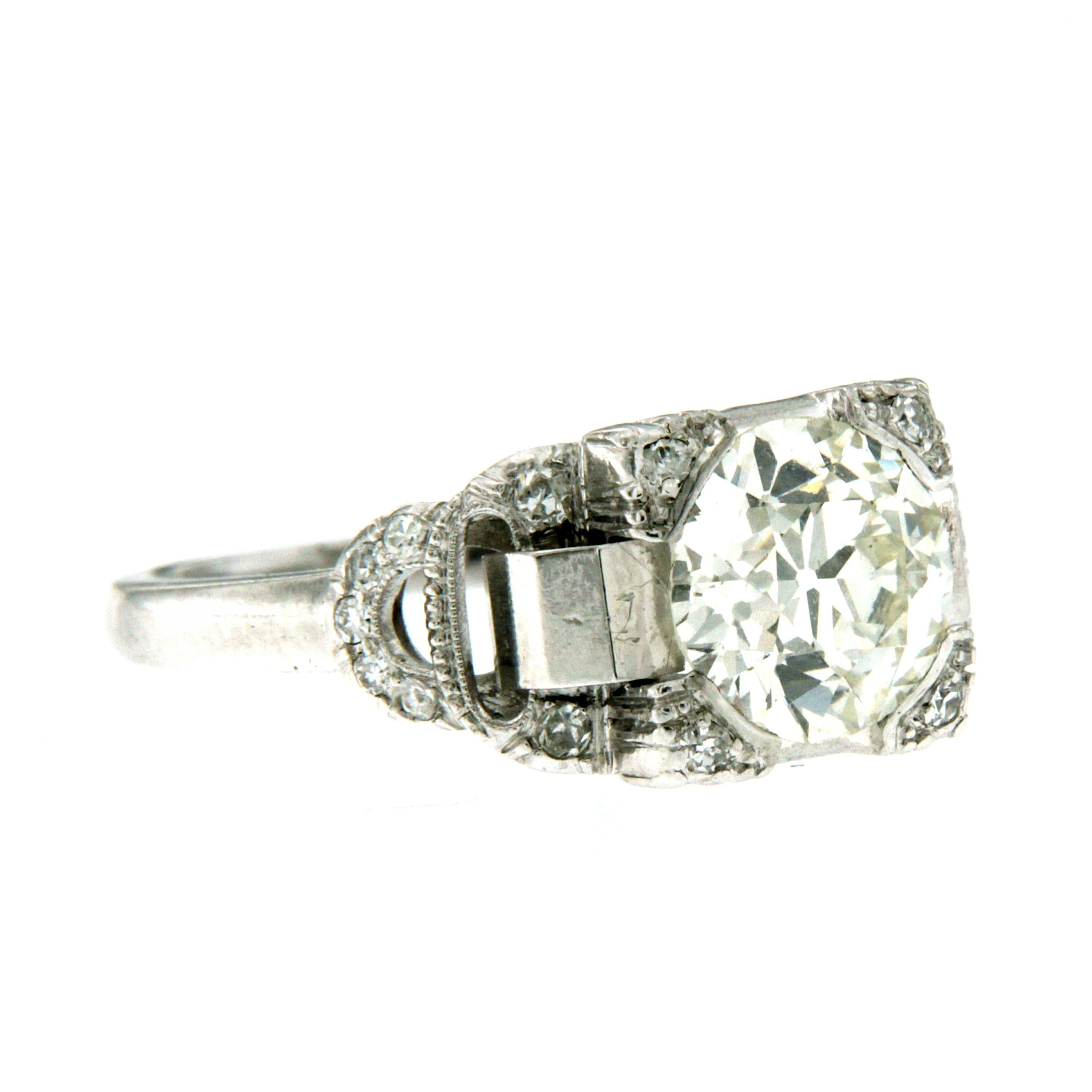 An exquisite example of Art Deco art, this ring hand-crafted in Platinum, authentic from 1920/1930, featuring in the center a sparkling 2.23 carats old mine-cut Diamond, more 0,15 carats on the setting.
The main stone is graded H/I vs1

The ring is