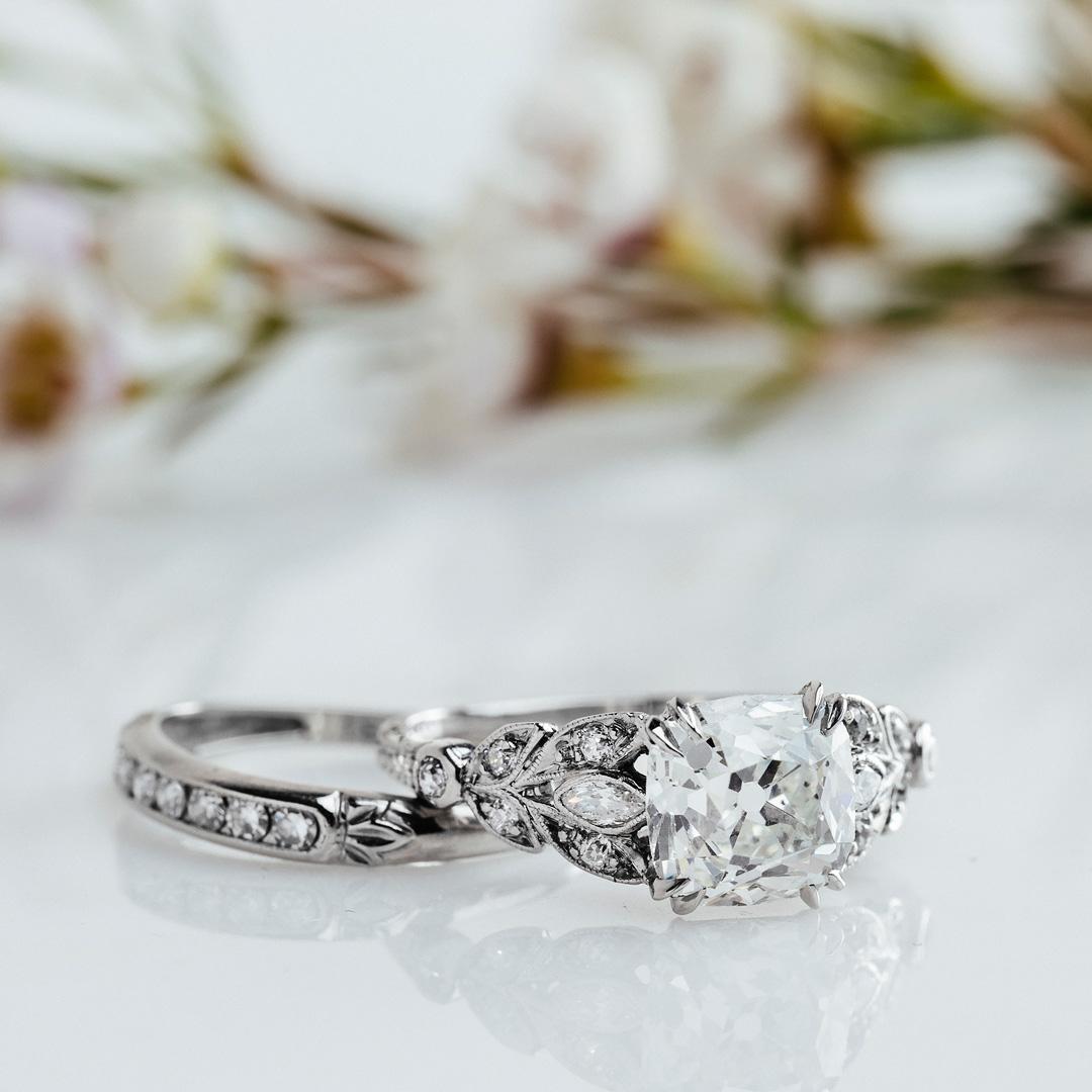 This is a show-stopping Art Deco (circa 1930) engagement ring with one of the most beautiful settings we have ever seen! This platinum ring centers a 2.46ct EGL certified Cushion Square Modified Brilliant Cut diamond graded H color and VS2 clarity.