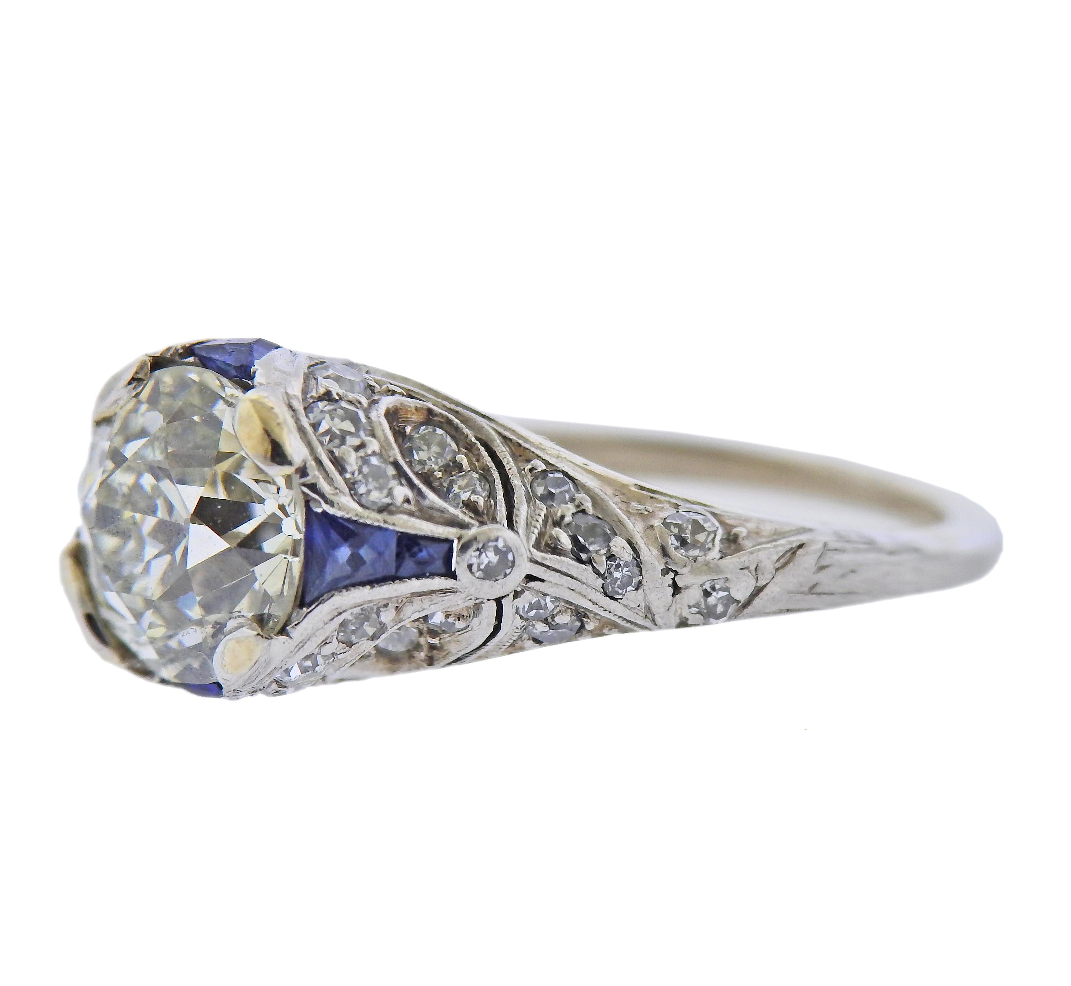 Art Deco platinum engagement ring, with center old European diamond approx. 2.48ct K-L/SI1-SI2. With side diamonds and sapphires. Ring size - 5.5, ring top - 9.7mm wide. Weight - 5.6 grams. 