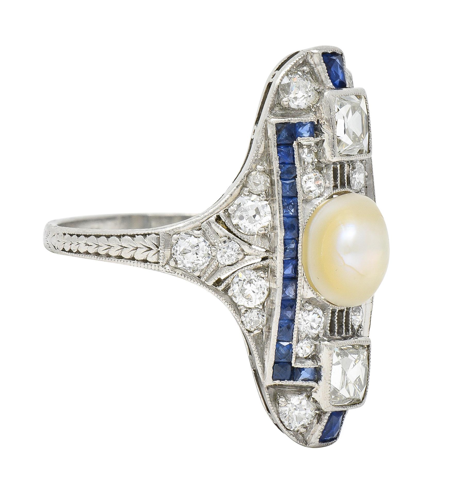 Centering a 6.9 mm near-round natural button pearl - cream in body color with strong iridescence
Flanked north and south by French cut diamonds weighing approximately 0.92 carat total
H color with VS2 clarity - bezel set with a pierced streamline