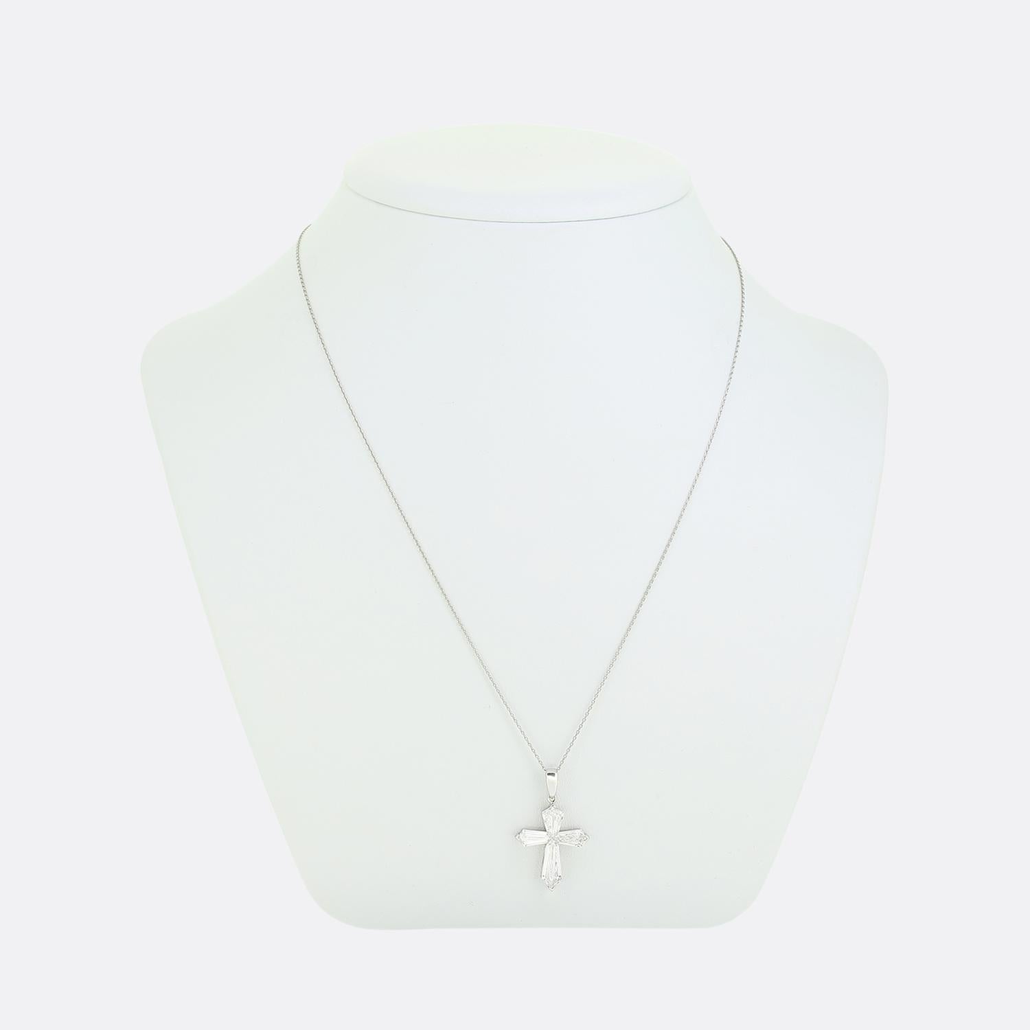 Here we have an exceptional piece taken from a time when the Art Deco style was at the height of world design. This platinum pendant remarkably forms the shape of a cross through the use of four expertly tapered baguette cut diamonds with the