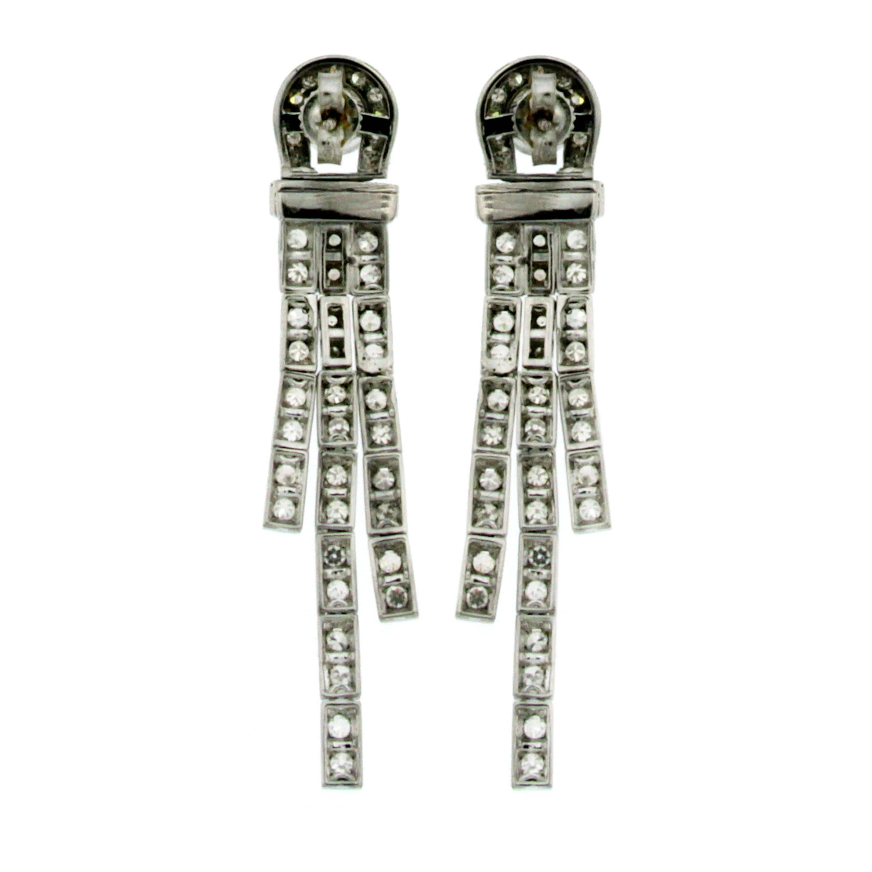 These Beautiful Art Deco 18k white gold earrings feature at the top 2 large Old Mine cut Diamonds weighing approx. 0,50 carats each, total weight 1 carat graded J color Vs clarity, connected by three rows of open links set with 96 colorless round