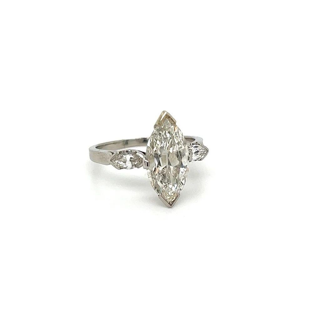 Simply Beautiful! Simply Beautiful! Vintage Art Deco Diamond Solitaire Platinum Ring. Centering a Marquise  Diamond, weighing approx. 2.53 Carat with 2 Marquise Side Diamonds, approx. 0.30tcw. Hand crafted Platinum mounting. Ring size 6, we offer